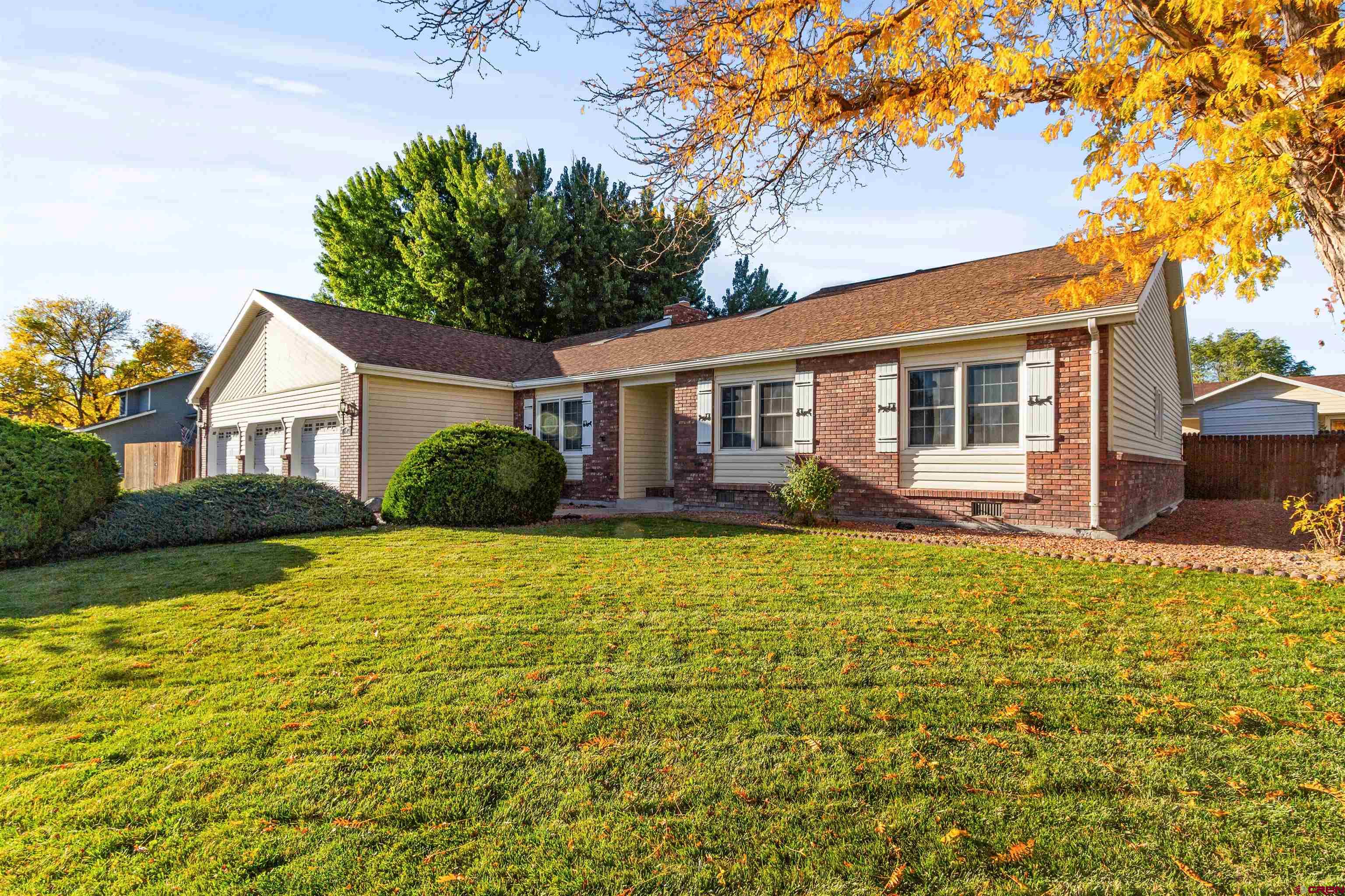 Welcome to 1649 Hermosa Street, a beautifully updated ranch-style gem on a spacious .33-acre irrigated lot in the highly sought-after Vista San Juan neighborhood. This home offers the perfect blend of in-town convenience with a serene, country-like atmosphere — a rare find in Montrose. Fully remodeled interior featuring a gourmet kitchen complete with granite countertops, subway tile backsplash, stainless steel appliances, 5-seat prep island, beverage fridge, and stylish laminate wood floors. The updates continue throughout with a modern primary bathroom remodel guest bath. 3 bedrooms, 2 baths, and a spacious 3-car garage, perfect for vehicles, storage, or your next project. The outdoor living area with lush lawns, mature shade trees, tool shed and a custom TRX deck—ideal for relaxing evenings or gatherings. Irrigation water is provided through a low-cost HOA, offering a sustainable and affordable alternative to city water. Located on Colorado’s scenic Western Slope, Montrose is known for its small-town charm, vibrant community, and access to year-round outdoor recreation. Whether it's fly-fishing in the Gunnison River, hiking the nearby Black Canyon of the Gunnison National Park, or skiing in Telluride just 1.5 hours away, Montrose is the ideal hub for nature lovers and adventure seekers alike. The city also offers excellent schools, a growing food and arts scene, and a welcoming, laid-back lifestyle that’s hard to beat. Don’t miss your chance to own this beautifully updated, centrally located retreat with space to breathe and room to grow. Schedule your showing today and experience the best of Montrose living!