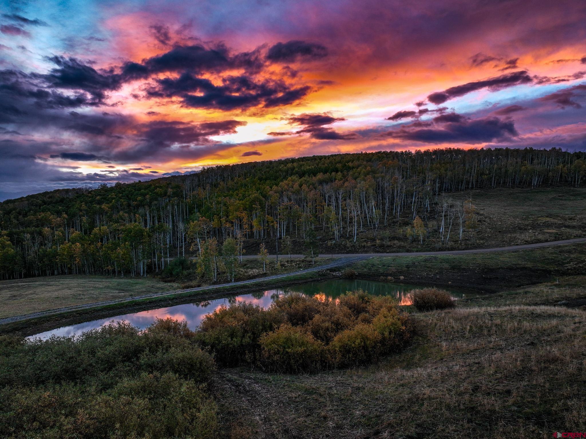 Spruce Mountain Ranch: Private Trout Pond & Trophy Hunting in GMU 62 Spruce Mountain Ranch is a 76.1± acre mountain retreat located in one of Colorado’s most scenic and wildlife-rich regions. Situated in Game Management Unit 62, the property offers the perfect balance of accessibility and seclusion—just 45± minutes from the Telluride Regional Airport and about an hour from Montrose Regional Airport. The ranch provides an ideal escape for outdoor enthusiasts and hunters and anglers due to the panoramic views of the San Juan Mountains and the private water that supports the thriving wildlife populations. Key Features: • Location: 76.1± acres in GMU 62, conveniently located approximately 1± hour from Montrose and 50± minutes from Telluride skiing. • Land & Water: About a half-acre, spring-fed private pond stocked with rainbow trout; aspen groves and mature timber throughout the property. • Improvements: Barn with potential living quarters—perfect for extended stays, guests, or use as a basecamp for hunting and recreation. • Recreation & Wildlife: Excellent archery hunting with high elk and deer concentrations; private gated access for enhanced privacy and security. Spruce Mountain Ranch sits in the heart of Colorado’s Western Slope, where the land is comprised of aspen and pine, and wildlife thrives year-round. The ranch’s pond, fed by a natural spring, creates a centerpiece for the property—ideal for fishing and wildlife.  The property’s location is within easy reach of the world-class skiing offered in Telluride and the conveniences of Montrose, yet the private gated access ensures privacy and separation. Hunters will appreciate the ranch’s location in GMU 62, known for its excellent archery seasons and strong elk and deer populations. Situated a short distance from GMU 61 and the uncompahgre plateau, resident hunters can take advantage of over-the-counter tags during 2nd and 3rd rifle seasons, while archery 1st and 4th rifle seasons are draw only. Whether you’re seeking a private recreational retreat, a family mountain getaway, or a legacy hunting property, Spruce Mountain Ranch combines all the best elements of Colorado living—privacy, scenery, and year-round activites.