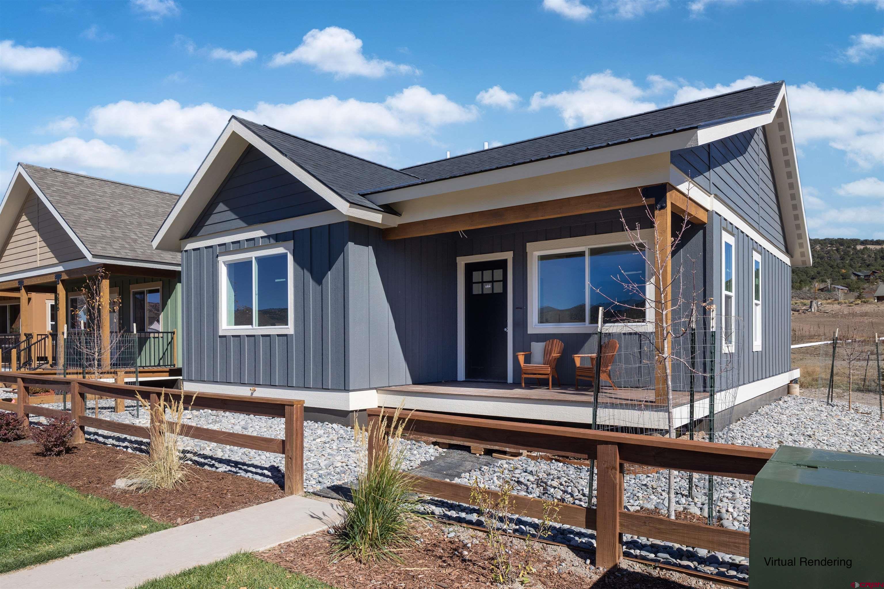 This brand-new 2-bedroom, 2-bath home is set for completion in November 2025 and is thoughtfully designed for modern mountain living. Enjoy sweeping mountain views from both the front porch and the back deck — perfect for morning coffee or evening sunsets. The owner is upgrading the finishes throughout, adding a custom touch to the final design.  The Vista Park Commons community is built around connection and comfort, featuring a clubhouse for gatherings, an oversized hot-tub and deck area for relaxing, and new storage units scheduled for completion by the end of December. Created to foster a friendly, interactive neighborhood, it’s also incredibly dog-friendly — the ideal spot for both people and pups to call home!  Conveniently located with easy access to downtown Ridgway, you’ll enjoy local restaurants, shops, hot springs, and all the charm this vibrant mountain town has to offer. Some photos of this listing may include virtually staged amenities, furniture or fixtures.