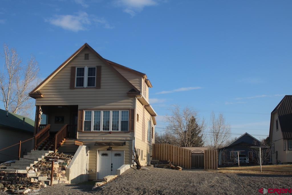 This home offers unique opportunities in Old Town Montrose. A wonderful 4 Bed, 3Bath Single Family Home, OR MANY OTHER CONFIGURATIONS !!! with a Full, Modern 1 Bed, 1 Bath Apartment in the Walkout Basement that can be isolated/separated from the upper 3 Bed 2 bath house the lower level has a proven history of generating $1600 monthly with traveling medical professionals. Live in the Upper 3 Bed, 2 Bath house and pay 1/2. your mortgage with travelers in the walk out basement.  Or a sound, proven rental investment @ $3,800 monthly for both sections of the home being rented. Totally remodeled and modernized nearly 2500sqft 4 Bed, 3 Bath home   w/ a 750sqft Modern Master Suite featuring 17x6 Walk-in Closet w/ Laundry, Large Master Bath, in-slab heat, Private Master Retreat with Kitchenette. ALSO this space would make a fine Multi-Generational Living unit w/ an independent 750sqft apartment with no stairs, Kitchenette and Laundry all on one level OR this house can be Configured as Two Totally independent Living Spaces ONE *3bed *2bath and the other *1bed *1Bath. Space off the alley for an future ADU,  Sewer already installed and Soil report completed for ADU. You will also benefit from a total remodel where, Plumbing, Electrical, Boiler, Kitchen, Bathrooms and every surface has been addressed. New Paint, Flooring, in-Slab Heating, Two Separate Laundries, New Plumbing, Modern Windows and Insulation. A large double lot, with Newly Fenced Yard and Alley access. New PVC Sewer line with RV plumbing (water and sewer) in the back lot ADU footprint. Can provide multiple Recent Rental contracts for $3,800 monthly. Very walkable, Bike Friendly Old Town Montrose. 7% CAP rate can make this a solid investment property. Soil test done for ADU off the alley that will further increase the investment performance. Located in the Montrose Zoning "REDO District" and Federal "Opportunity Zone" both allow Special Development Discounts and Variances along with Unique Tax Benefits