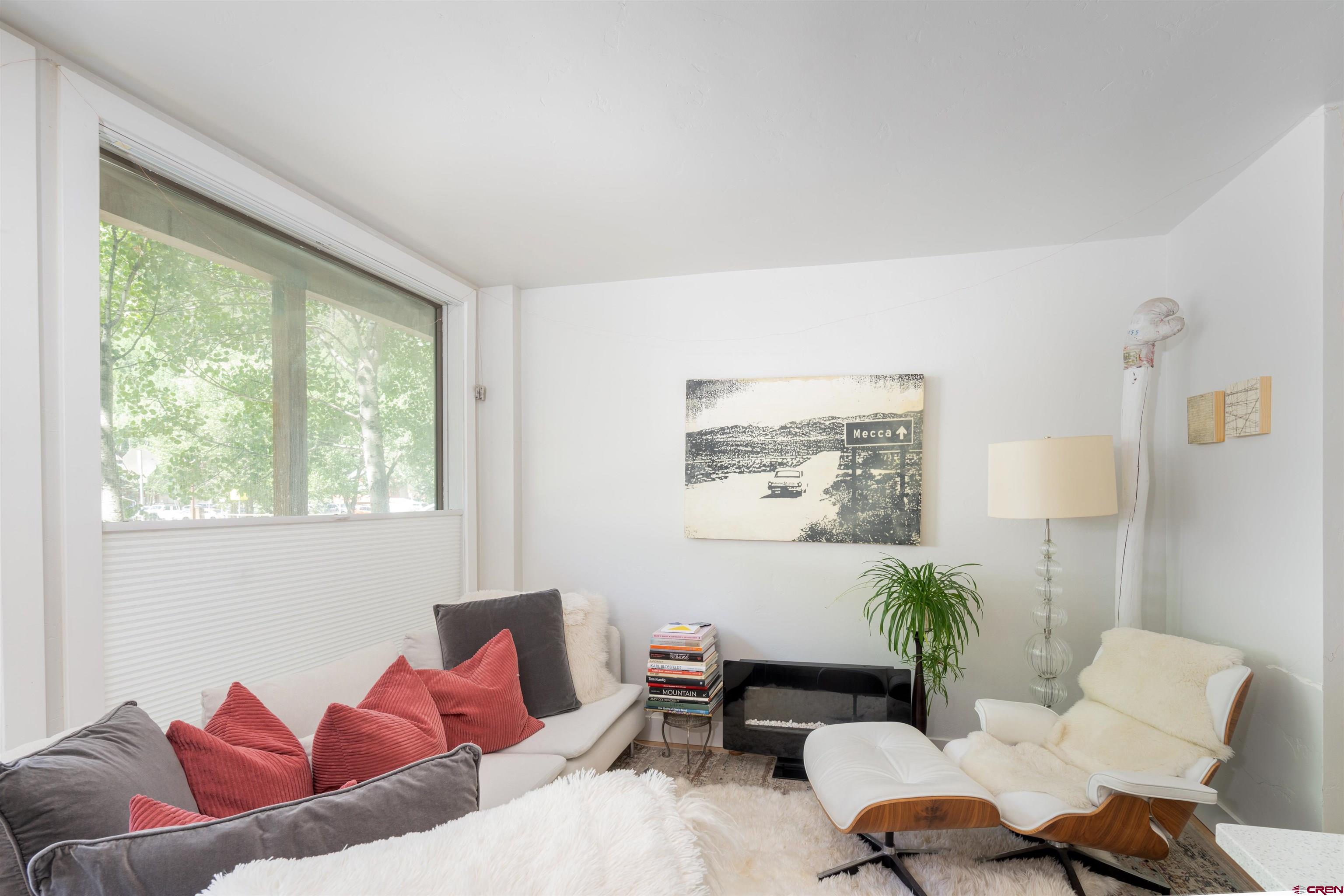 Welcome to this comfortable, cozy renovated two-bedroom, two bath, one-story flat on the west end of Telluride. This minimalist condo features simple finishes with an artist's touch, creating a bright, contemporary, and clean living space. Ideally situated, just steps away from ski lifts, trails, grocery store, and the town bus, providing easy access to Telluride's abundant amenities without needing a car. The common area heated pool and hot tub are available year round. This flat is designed with an open layout, combining living, kitchen, and dining areas into one beautifully designed space and allows for easy access off Pacific Street with no common area hallways. The additional bedroom can be set up as rental lock off allowing flexibility for renting as a studio or two bedroom.