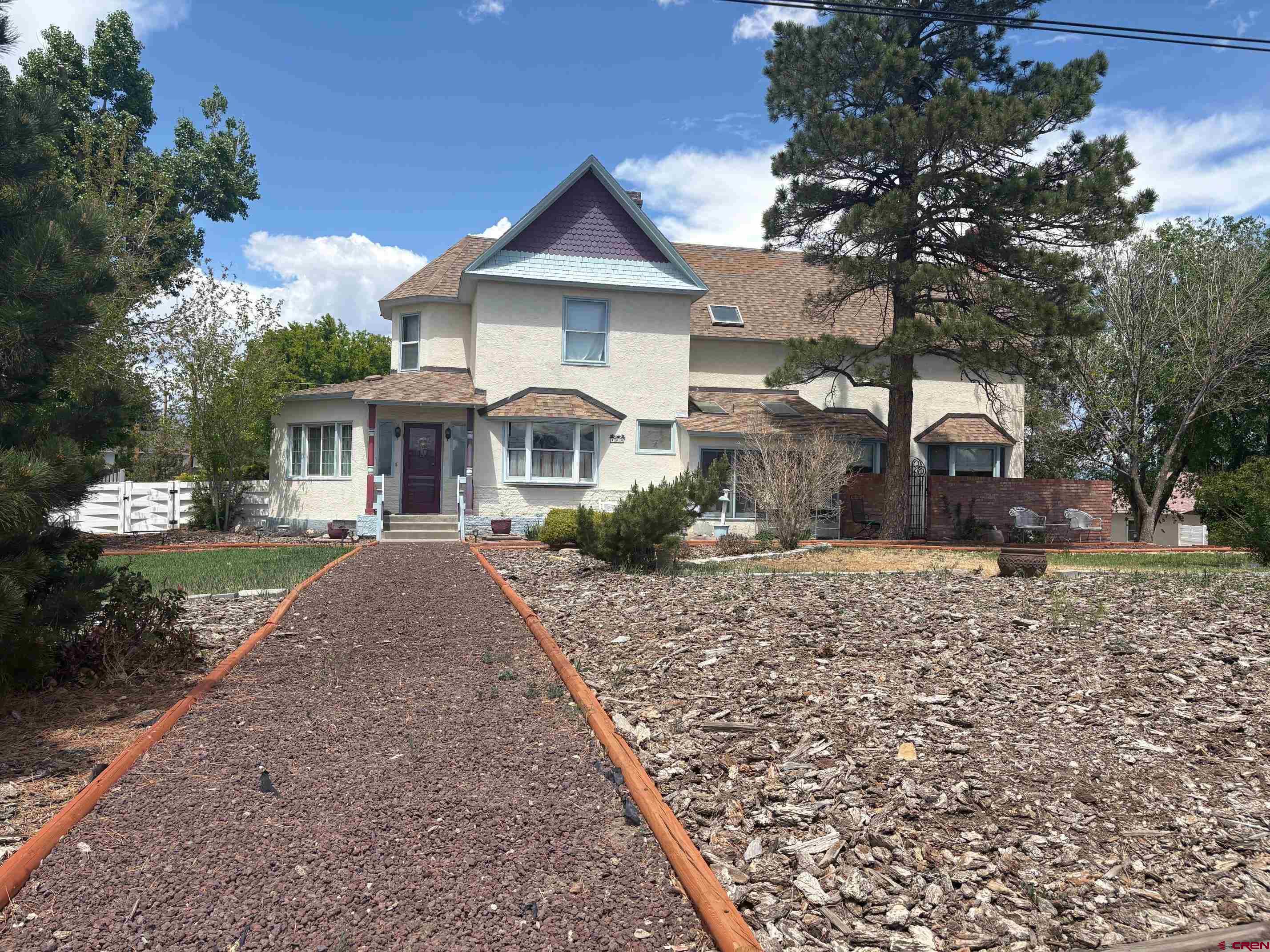 Step back in time to the Glorious Victorian Era when you enter into this 4,000 plus grand home lovingly brought back to it's former glory days, with ornately carved mahogany wood elegantly displayed throughout this 4 bedroom, 3 bath home.  Beautiful original wood floors in the formal dining room lead to the culinary kitchen with its expansive center island that would be any chef's delight. One could get lost in this beautiful home with the master bedroom and other sleeping quarters on the second floor, the living, dining, and chef's kitchen on the main floor and the billiard room in the Rec room/basement.  There is a new oven, microwave, new hot water heater, updated sprinkler system and a brand new sewer line as well.