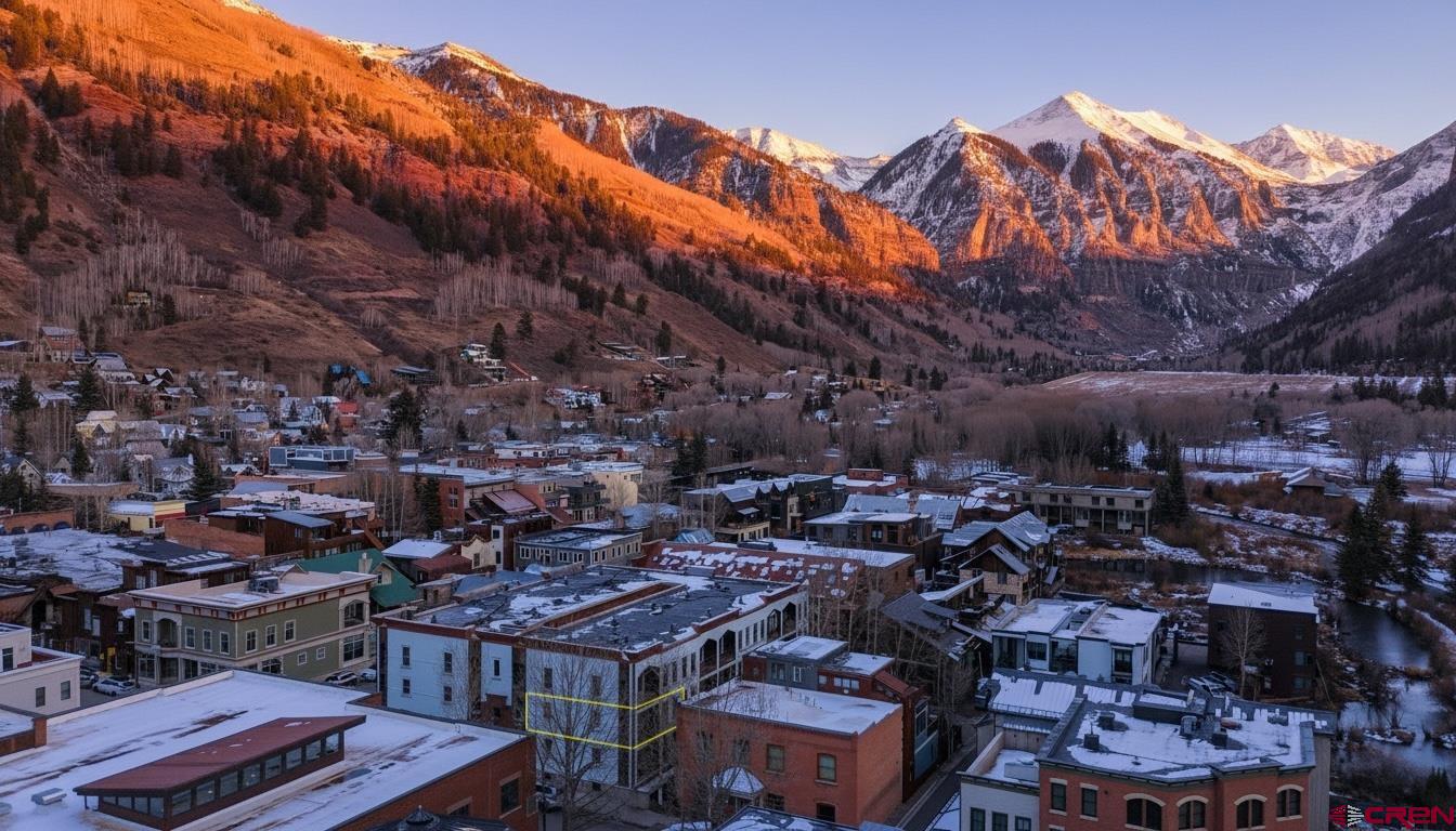 Live just steps from Main Street in this dialed-in two bedroom Telluride gem. With the gondola, restaurants, and Town Park all within a quick walk, this location is tough to beat. Soak in big mountain views from your private deck, then head inside to a smart, efficient layout complete with a full bath, in-unit laundry, and a covered parking space.  Owners also enjoy access to a shared hot tub for après-adventure relaxation. Whether you're after a prime in-town crash pad, a lock-and-leave getaway, or a strong rental performer, this property checks every box.