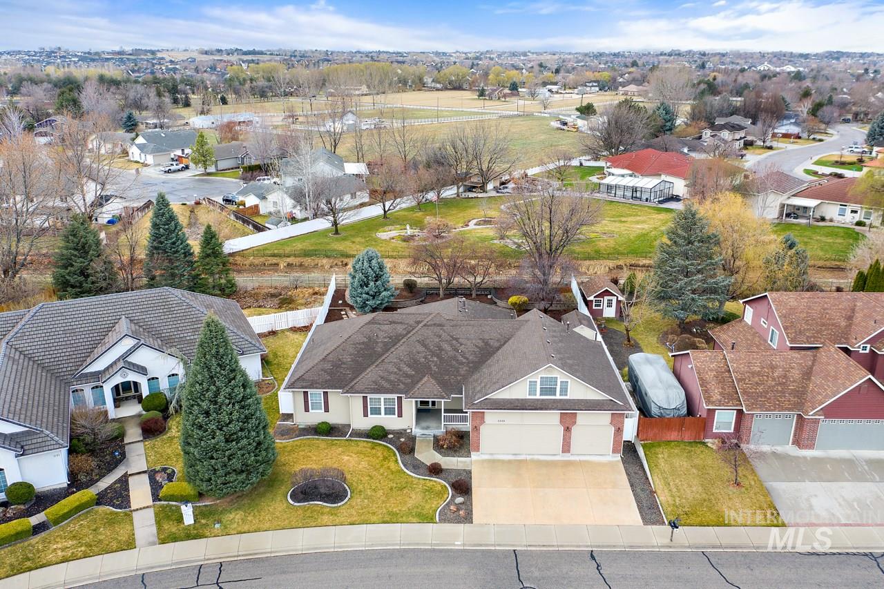 Pristine! Beauty in lovely neighborhood w/no neighbors behind. 3 beds+bonus room w/ 1/2 bath. Large kitchen w/quartz counters, WI pantry, newer upscale Kitchenaide appl, gas range. Gorgeous real hdwd floors throughout kitchen, eating, hall, entry. Large great room w/tons of windows & privacy. 2 sided gas frplc. Generous sized rooms. Newer roof, HVAC, sep air for bonus. Relax on huge, private, cvd patio w/open space behind. Oversized wider & deeper garage, 8x12 shed, full spkls off irrig.  Meticulous & Clean