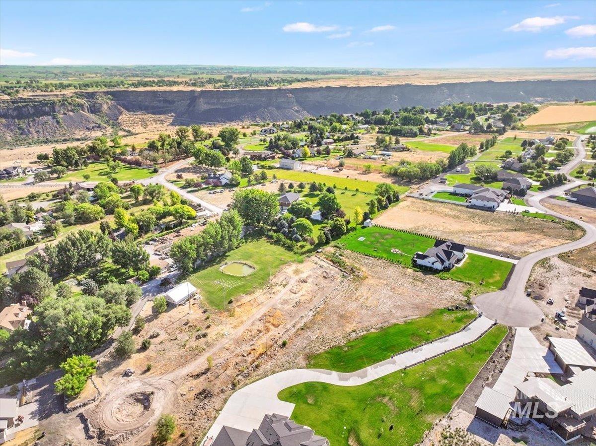 View of property location with nearby suburban area