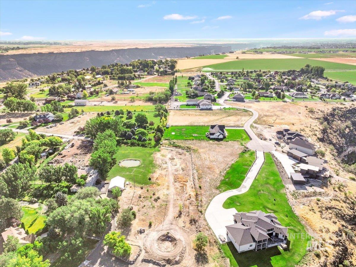 Aerial view of property's location featuring nearby suburban area