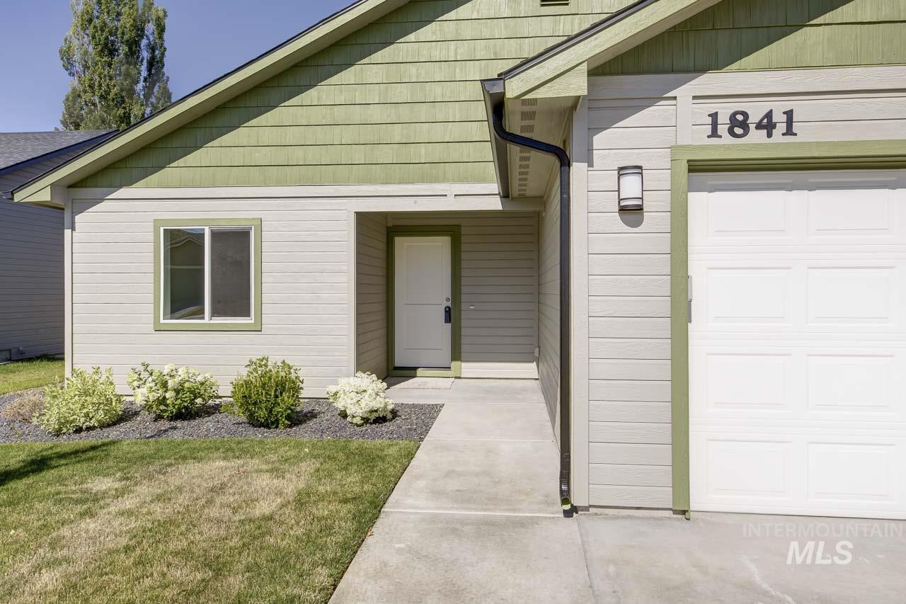 Property entrance featuring a garage