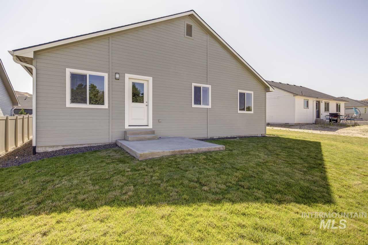Back of property with a patio and entry steps