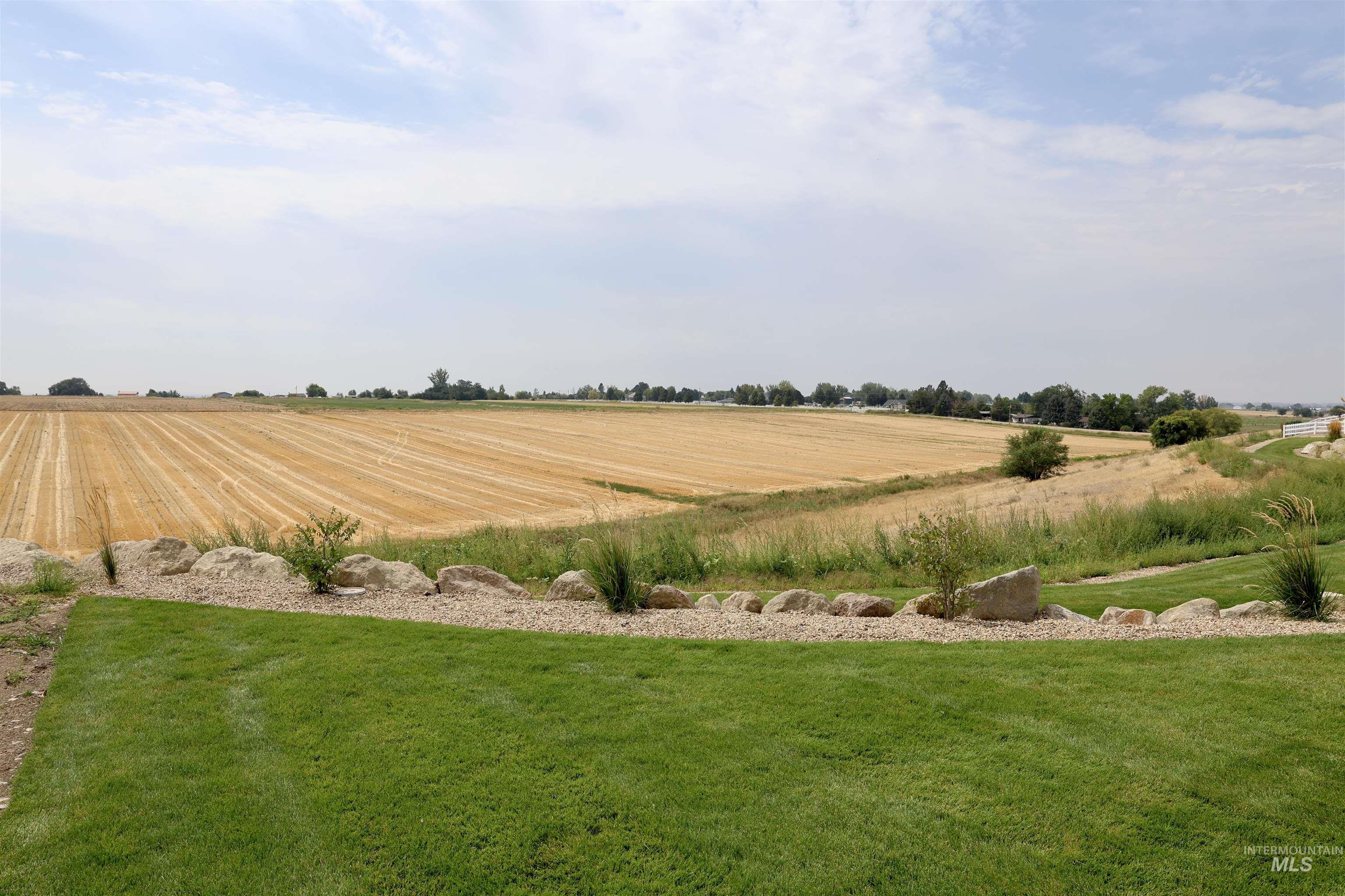 View of green lawn with a view of countryside