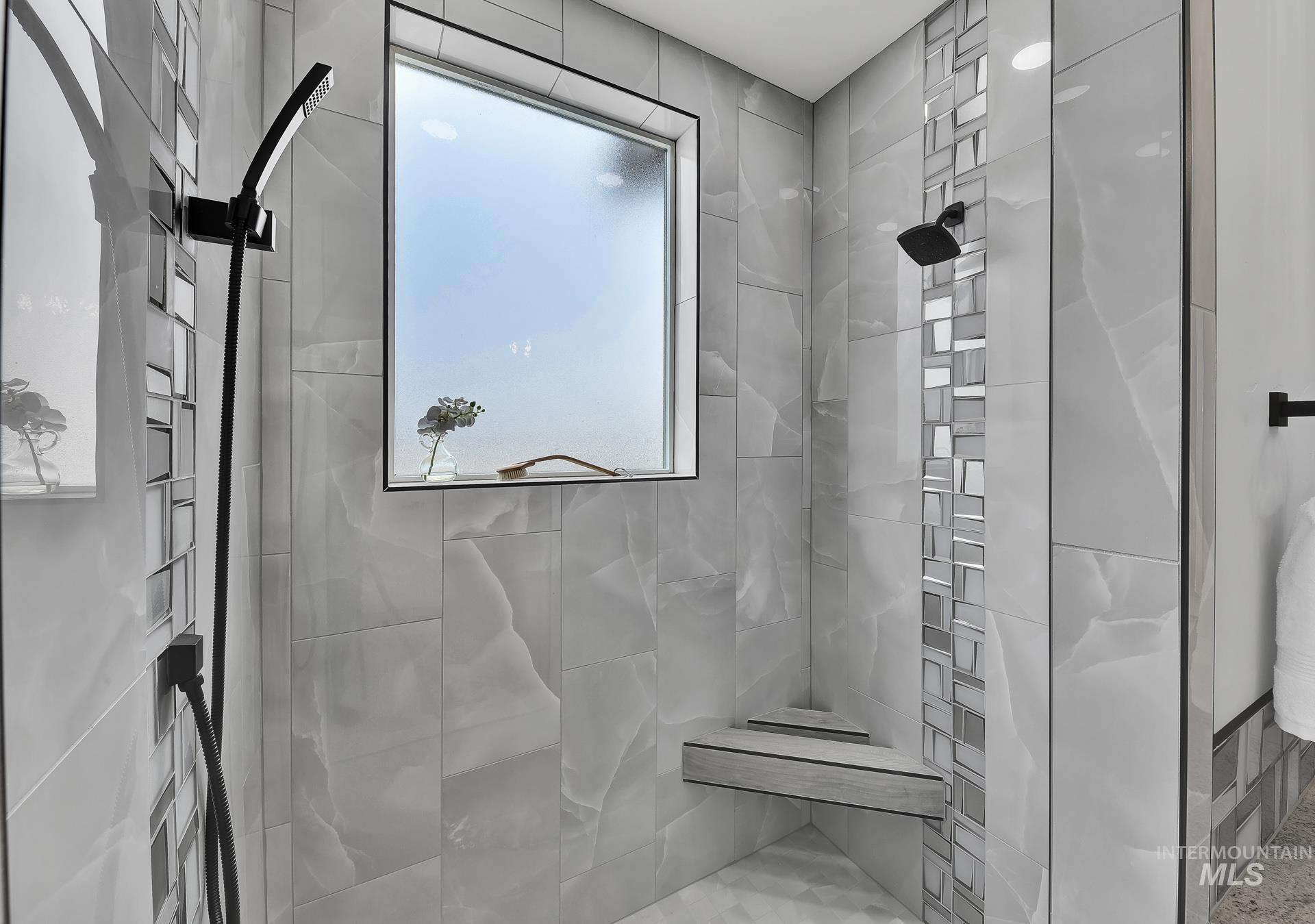 Full bath with a tile shower