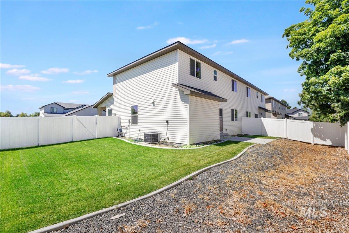 Back of house featuring a fenced backyard
