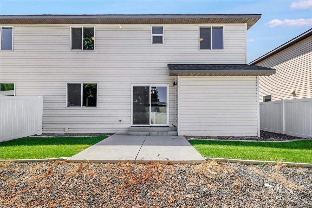Back of house with a patio