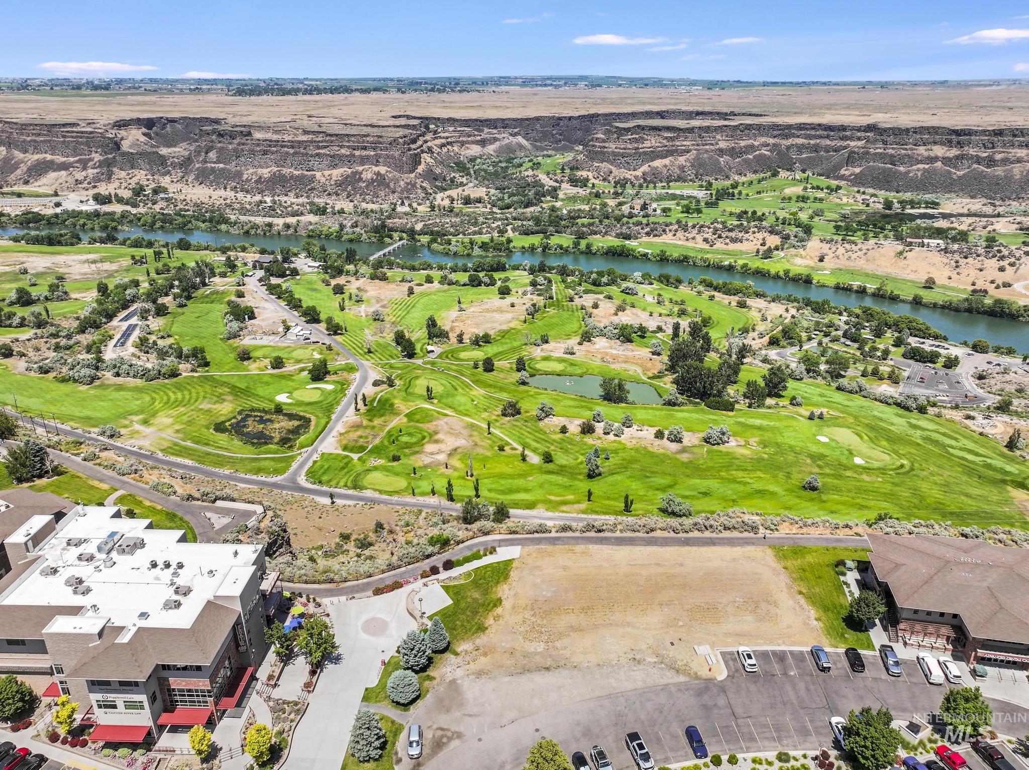 Bird's eye view of a nearby body of water and a golf course