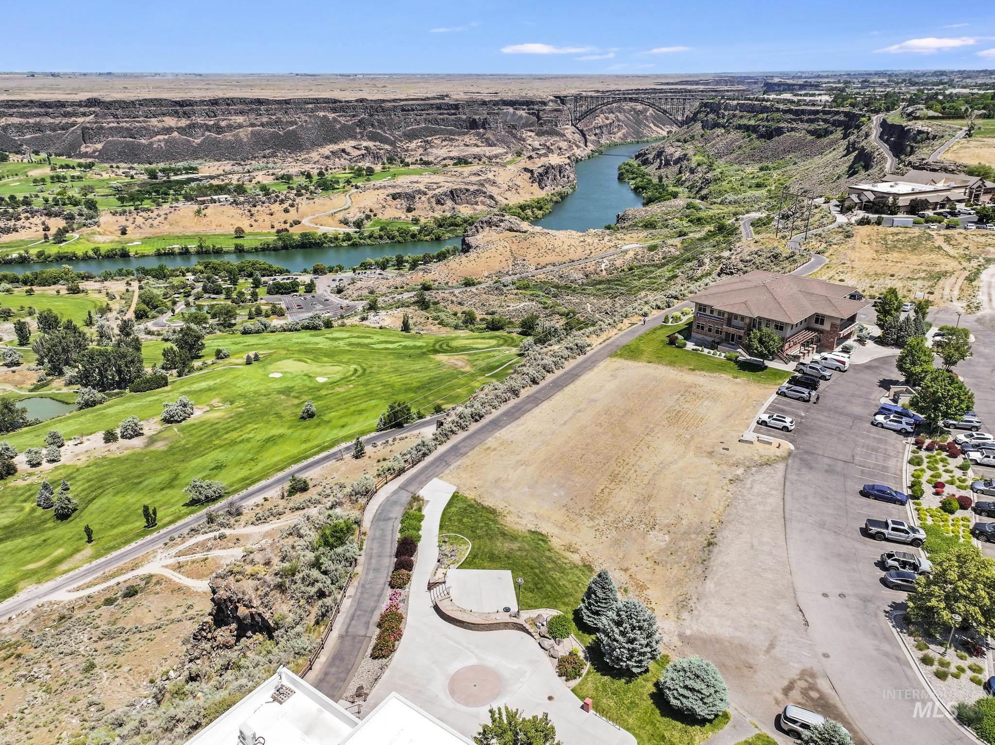 Aerial view of a nearby body of water and a golf course