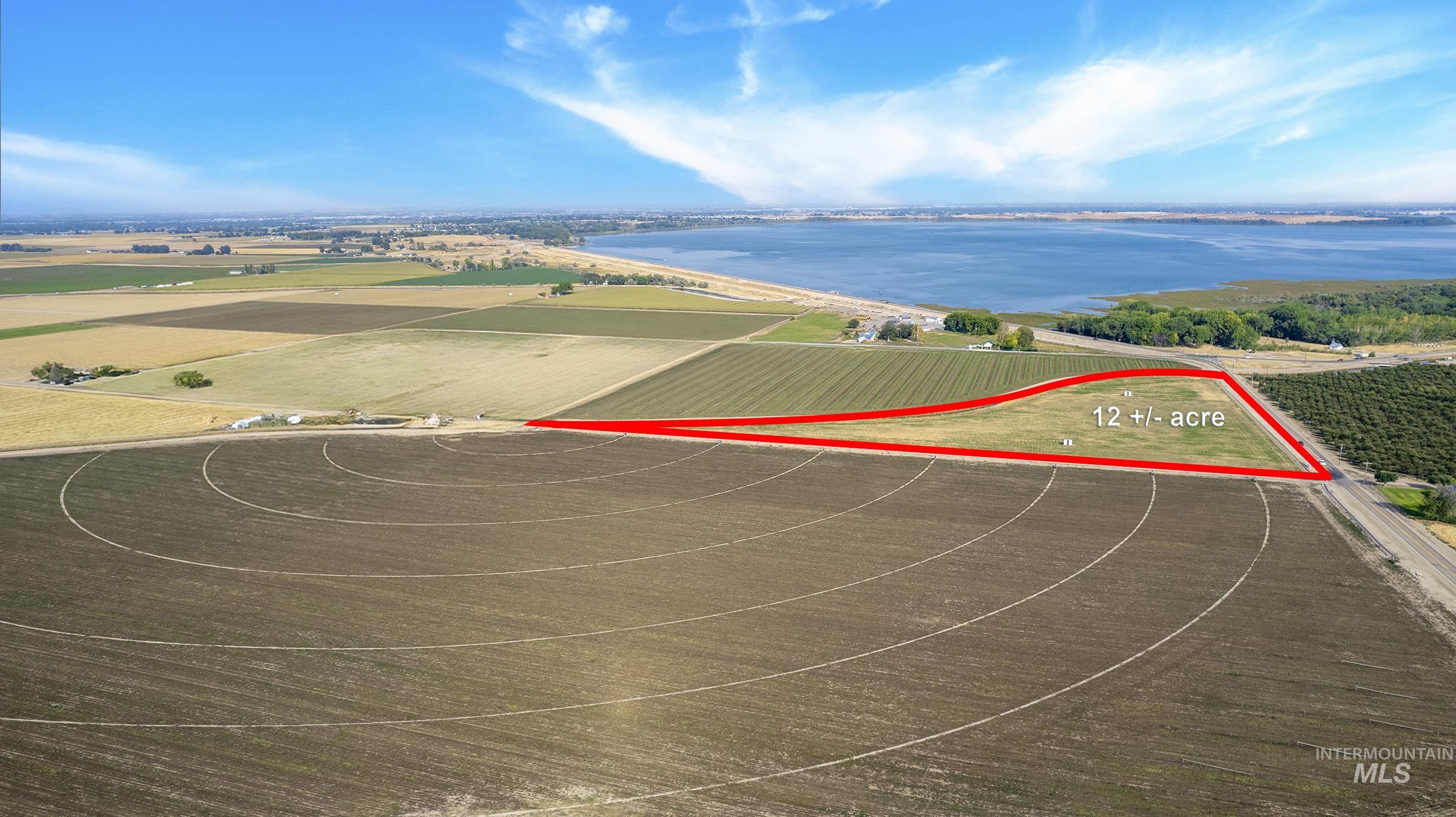 View of rural area with property boundaries highlighted and a large body of water