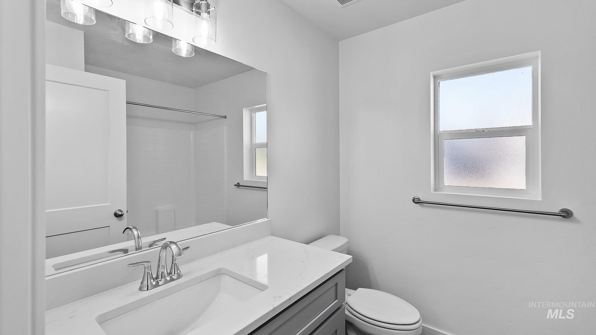 Full bathroom featuring vanity and a shower