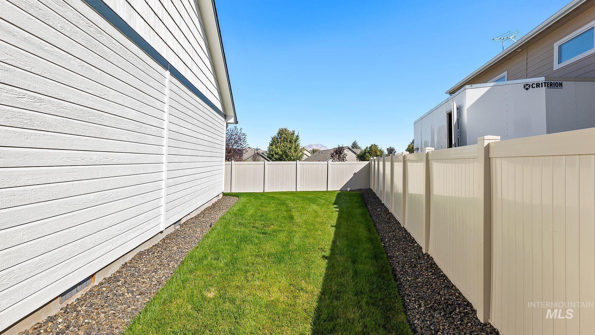 View of fenced backyard
