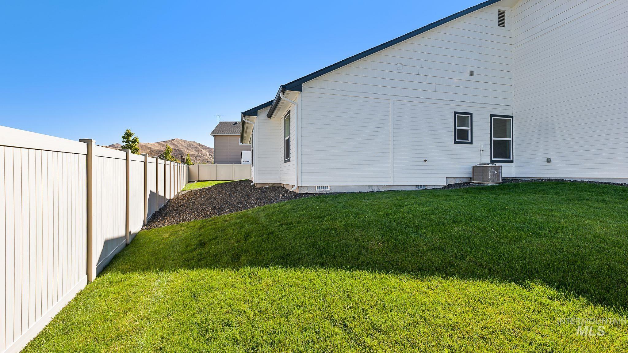 View of home's exterior with a cooling unit