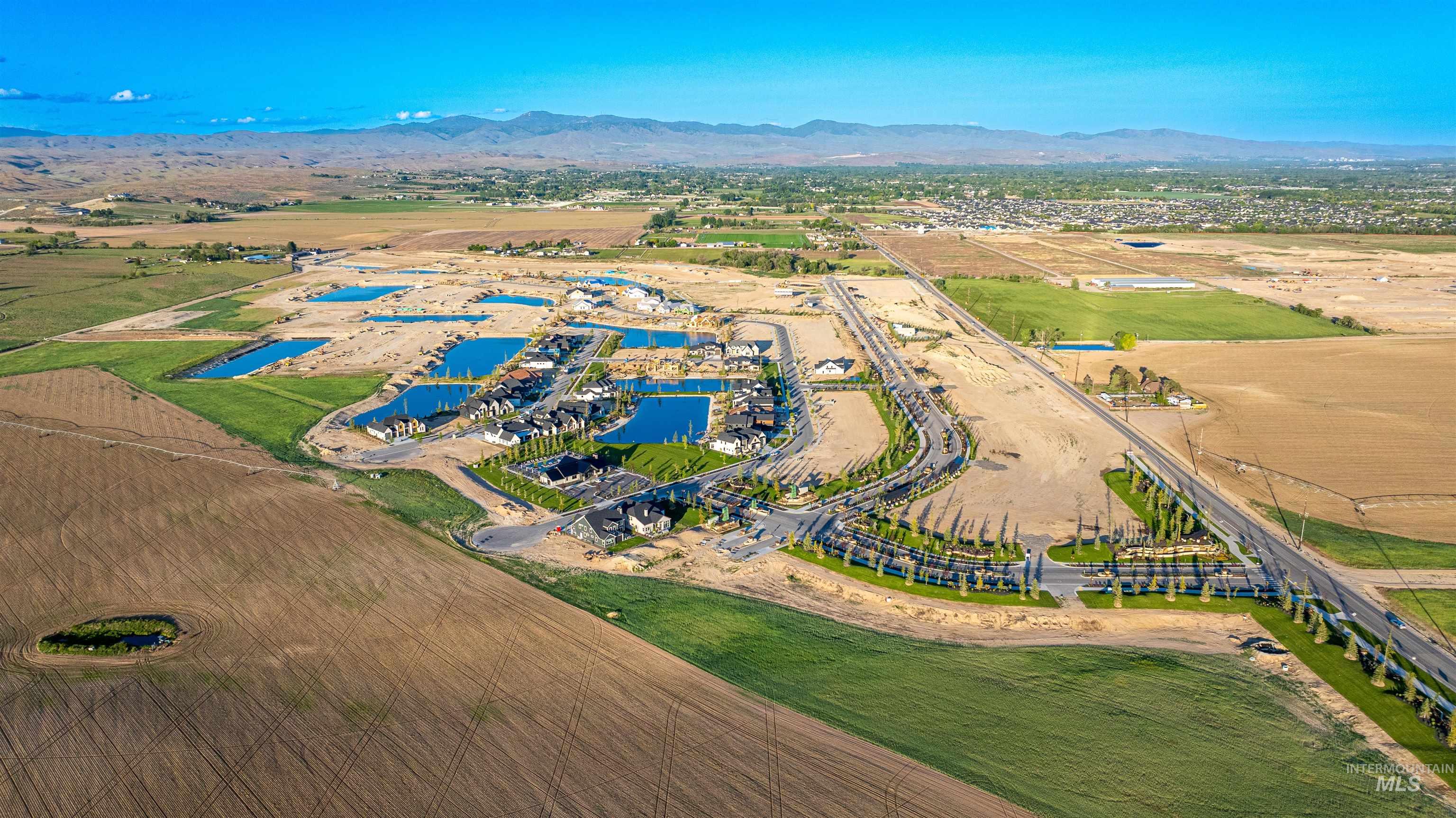 View of property location featuring a water and mountain view and rural landscape