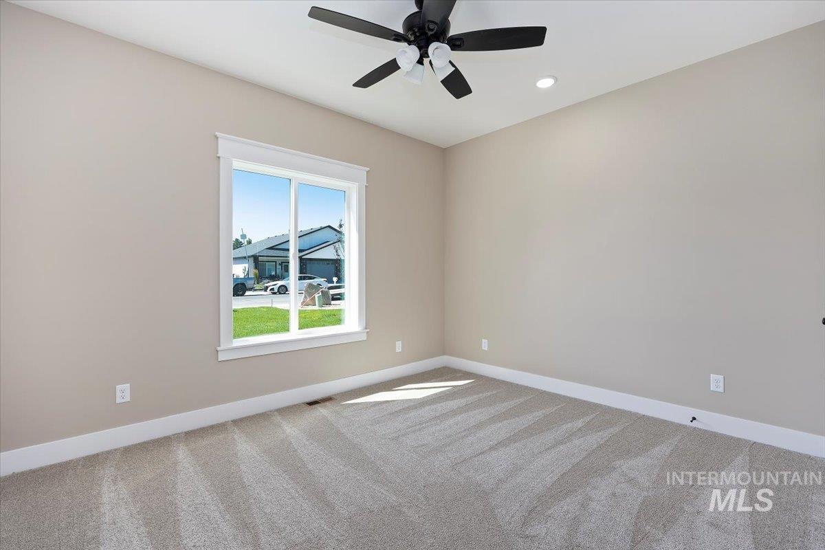 Unfurnished room with light colored carpet, recessed lighting, and ceiling fan