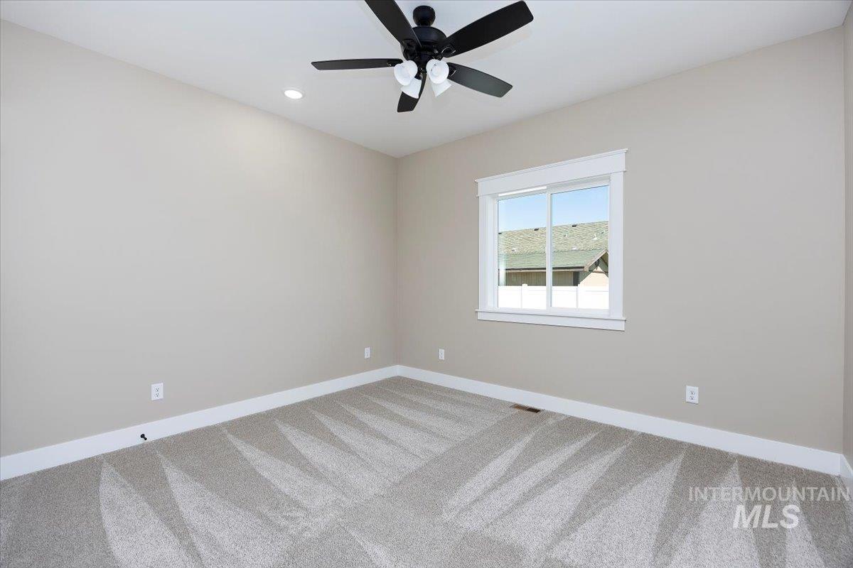 Unfurnished room featuring carpet, recessed lighting, and ceiling fan