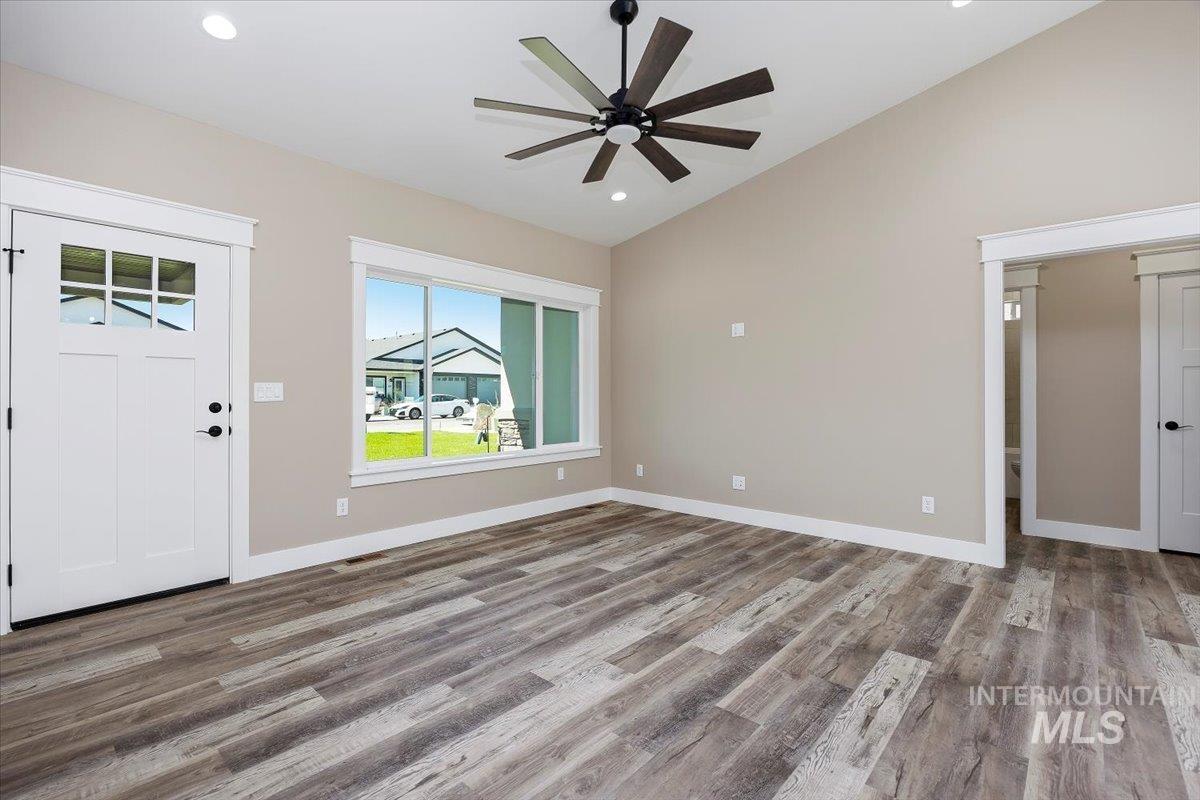 Entryway featuring light wood-type flooring, vaulted ceiling, recessed lighting, and ceiling fan