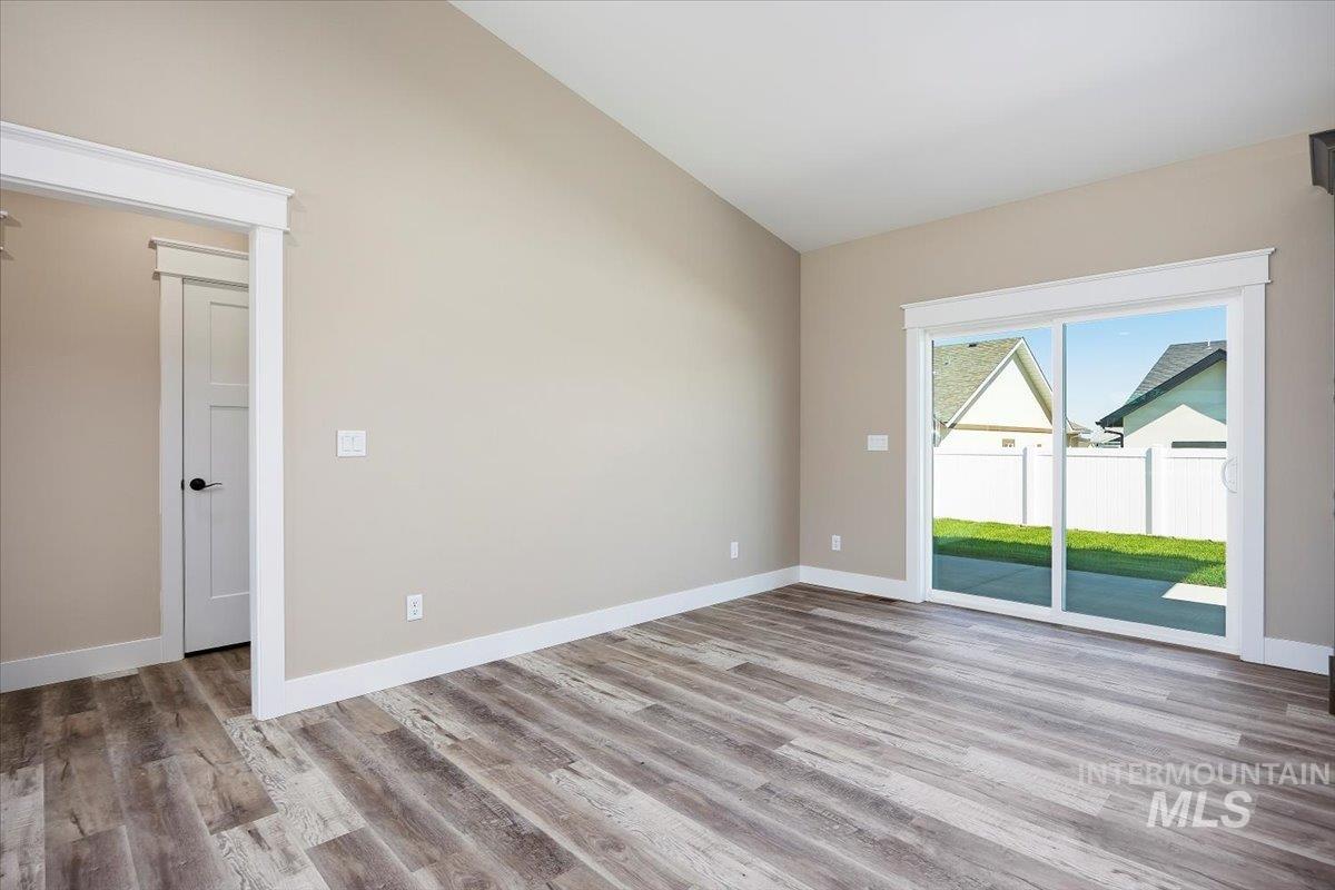 Empty room featuring light wood-type flooring and baseboards