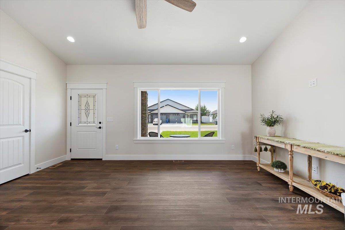 Foyer with recessed lighting, dark wood finished floors, and ceiling fan