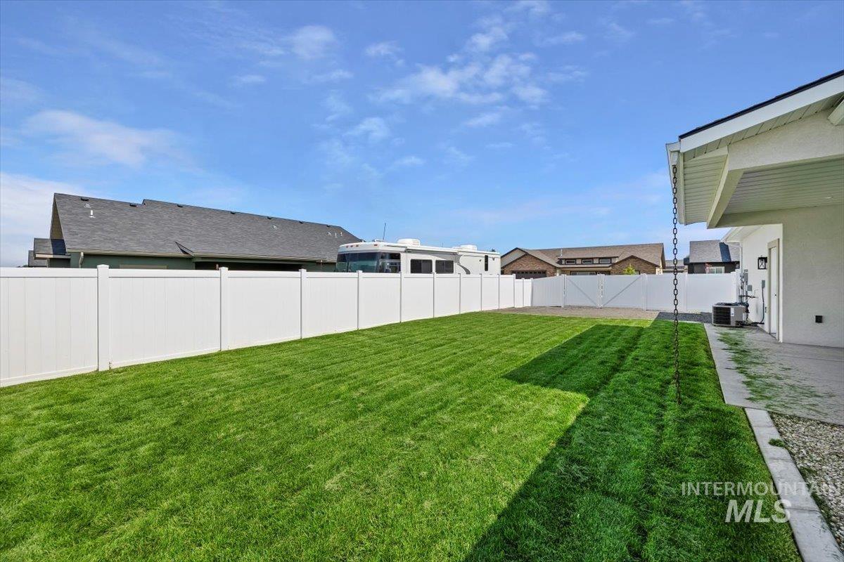 Fenced backyard with a patio area