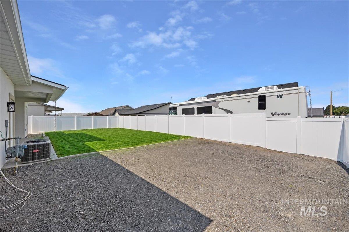 Fenced backyard with a patio area