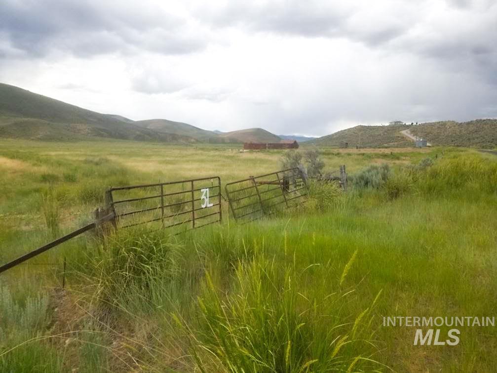 View of yard featuring a view of rural / pastoral area and a mountain view