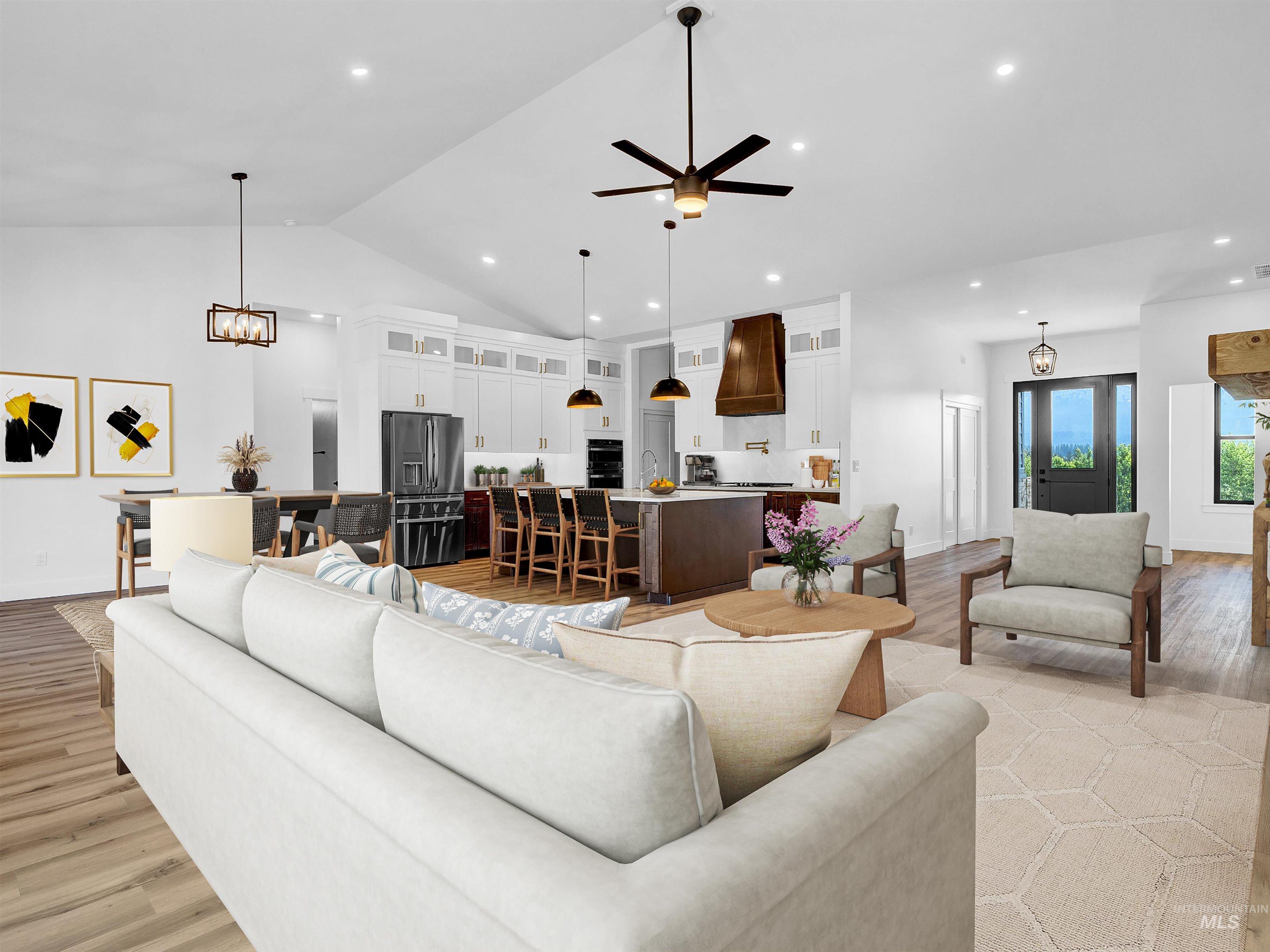 Living area with recessed lighting, light wood-type flooring, lofted ceiling, and a ceiling fan