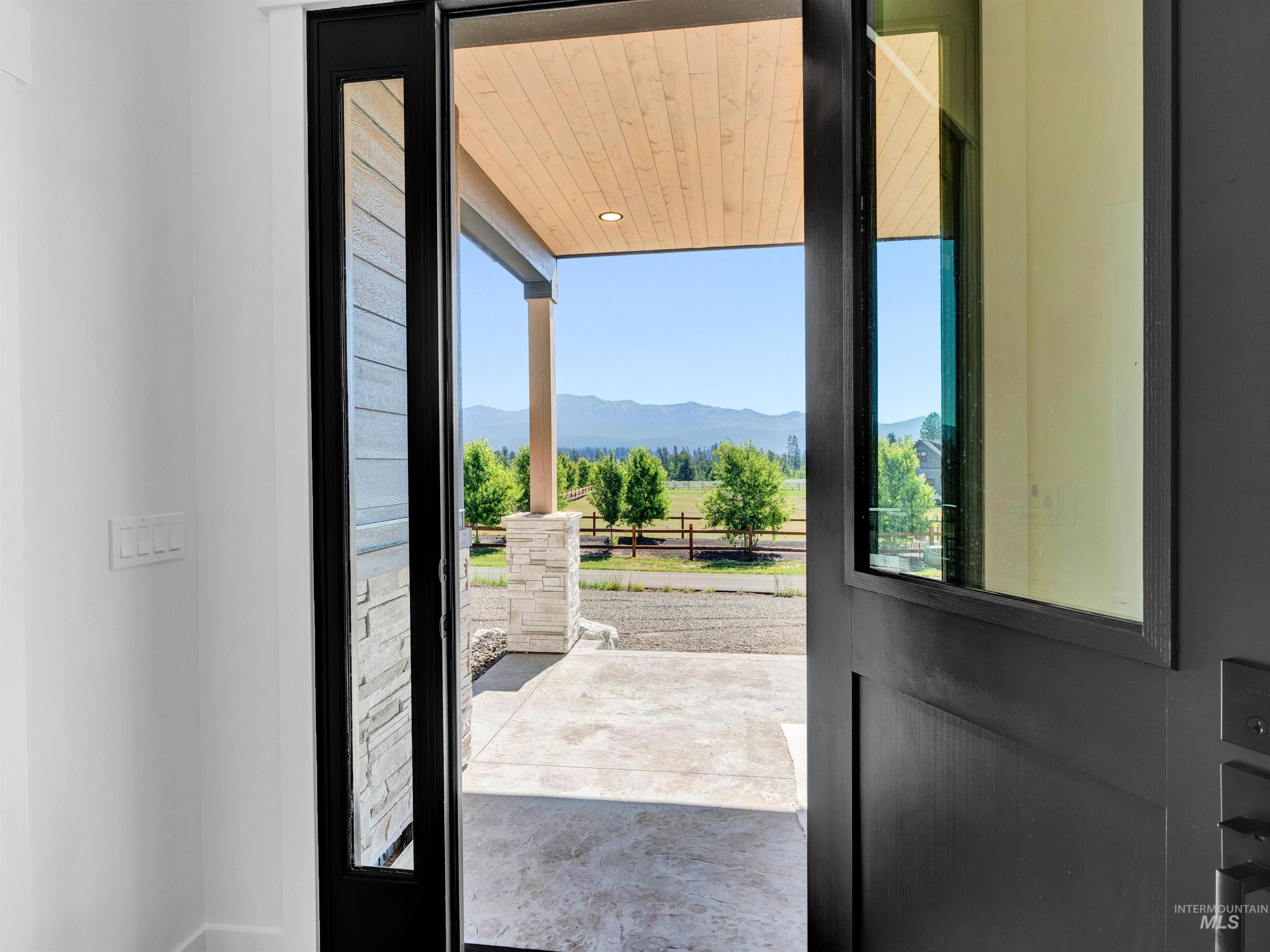 Doorway featuring a mountain view