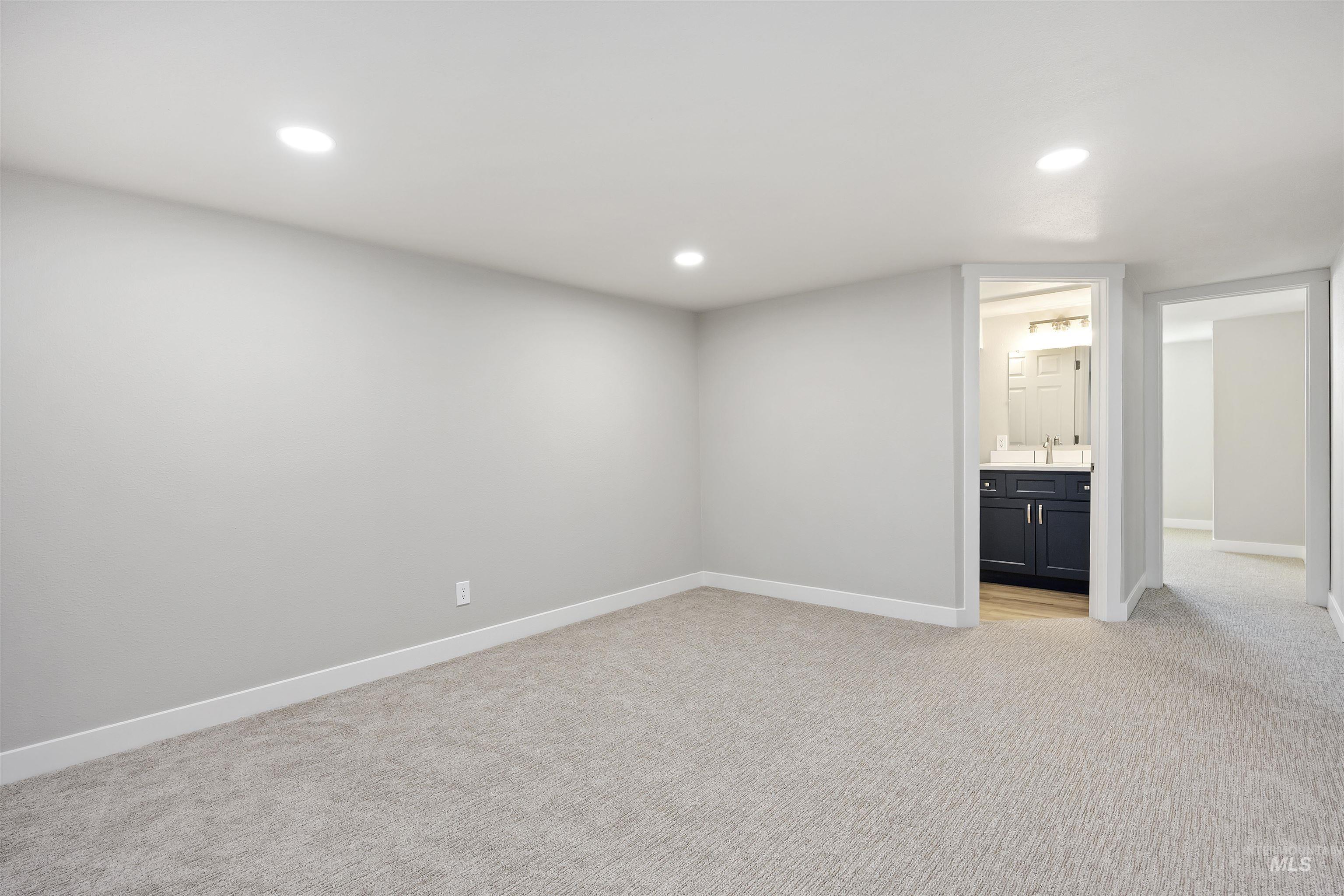 Unfurnished room featuring light carpet and recessed lighting