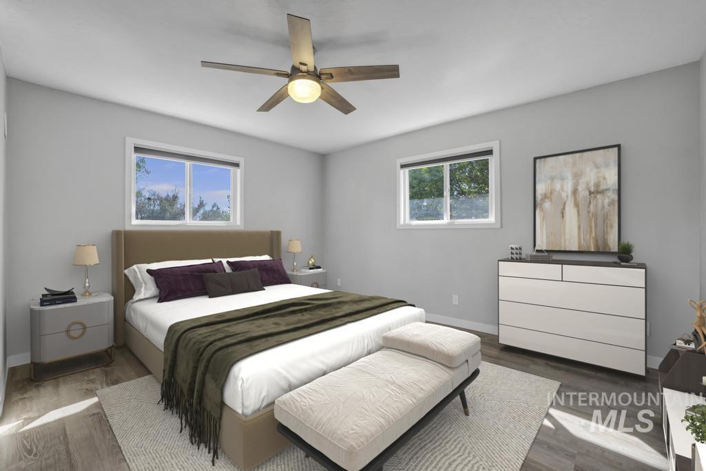 Bedroom featuring wood finished floors and a ceiling fan