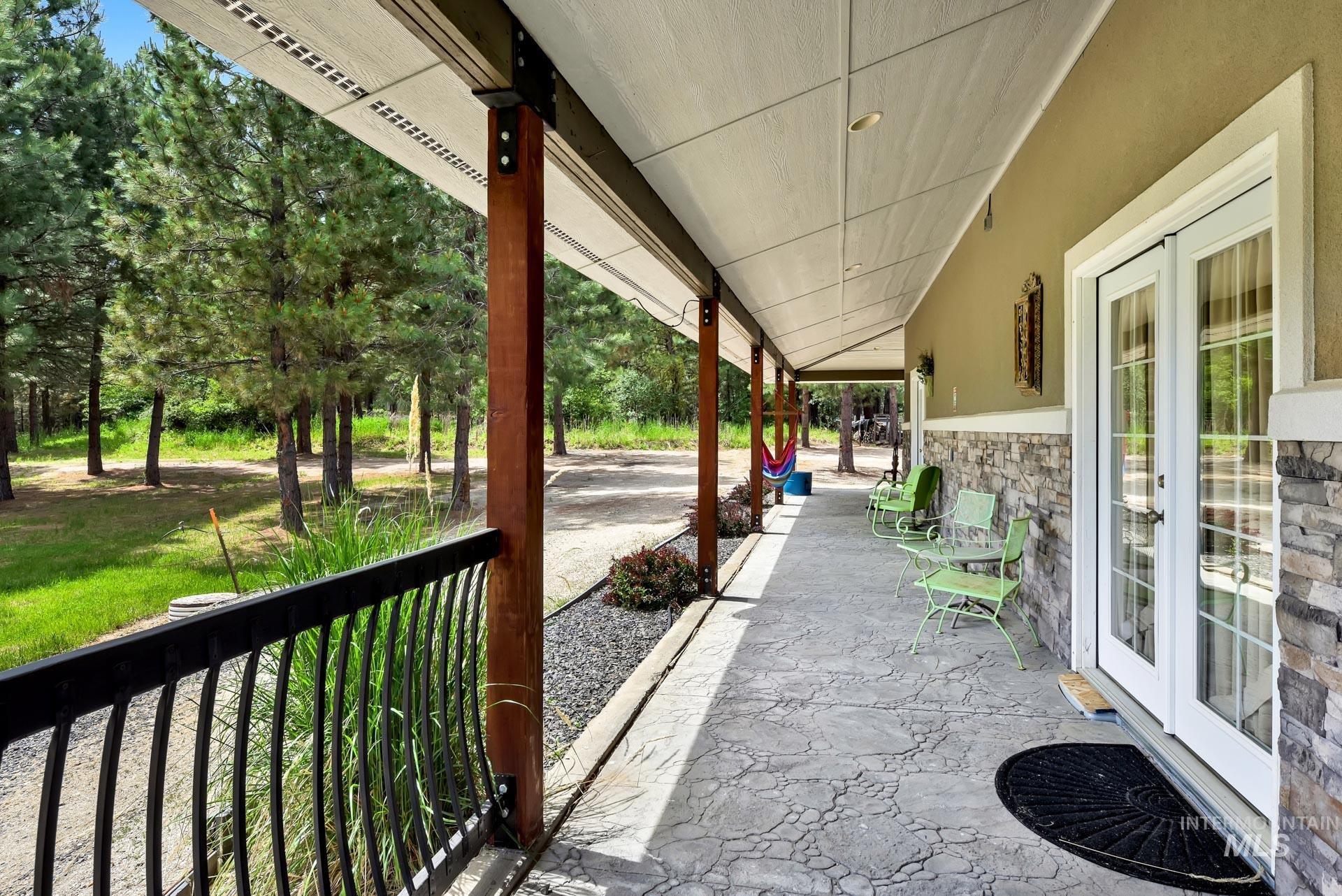 Side of home with covered walk way and French door access to the yard