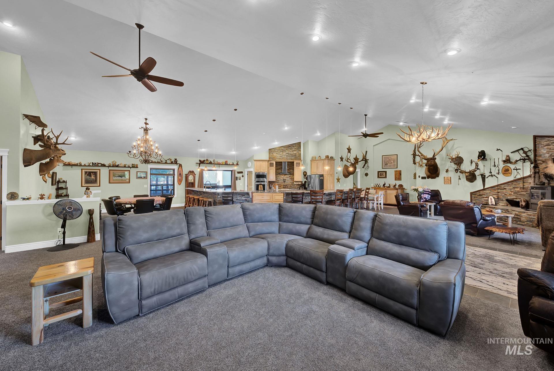 Open plan concept with great room soaring vaults and rustic charm