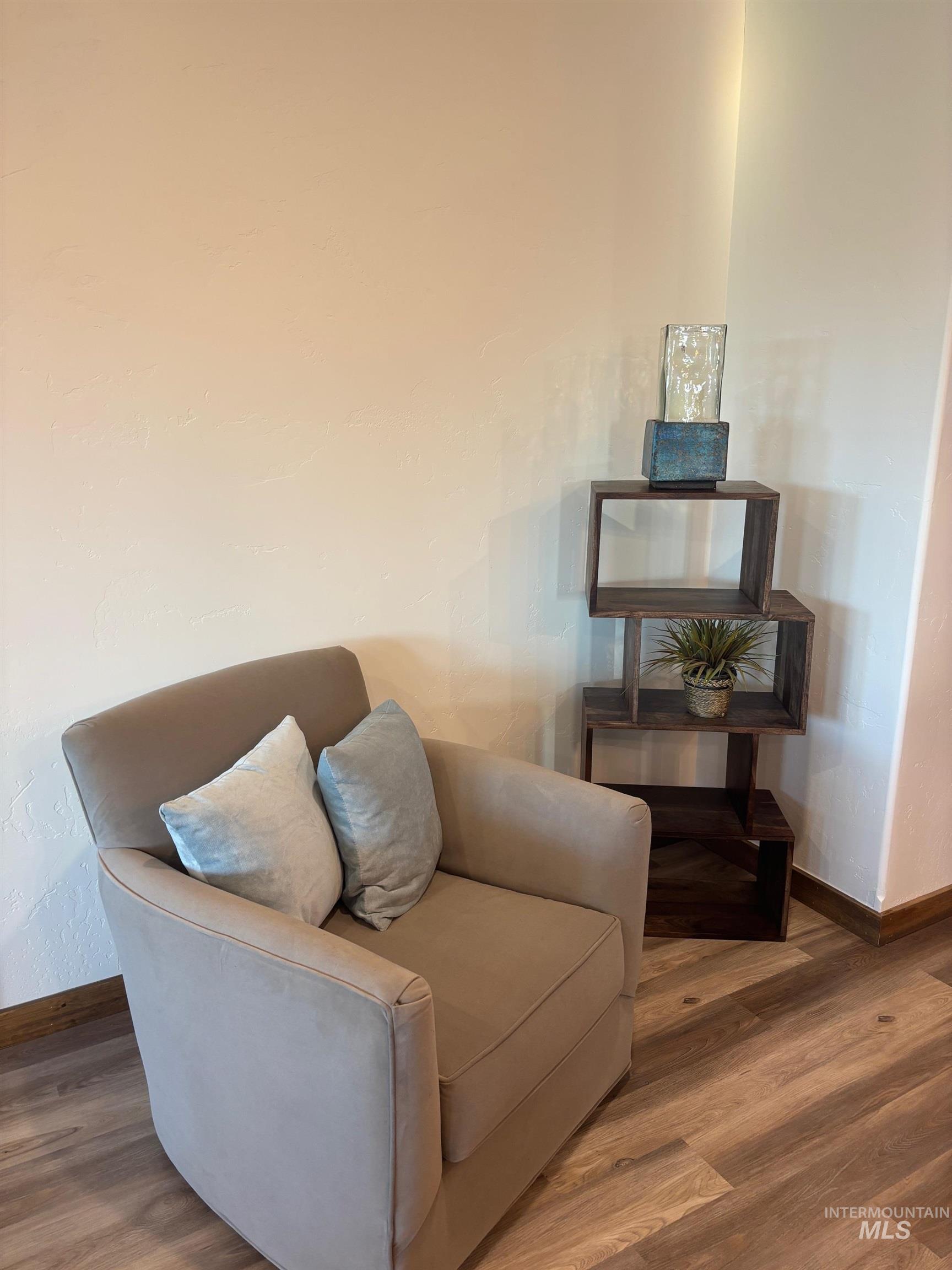 Sitting room with wood finished floors