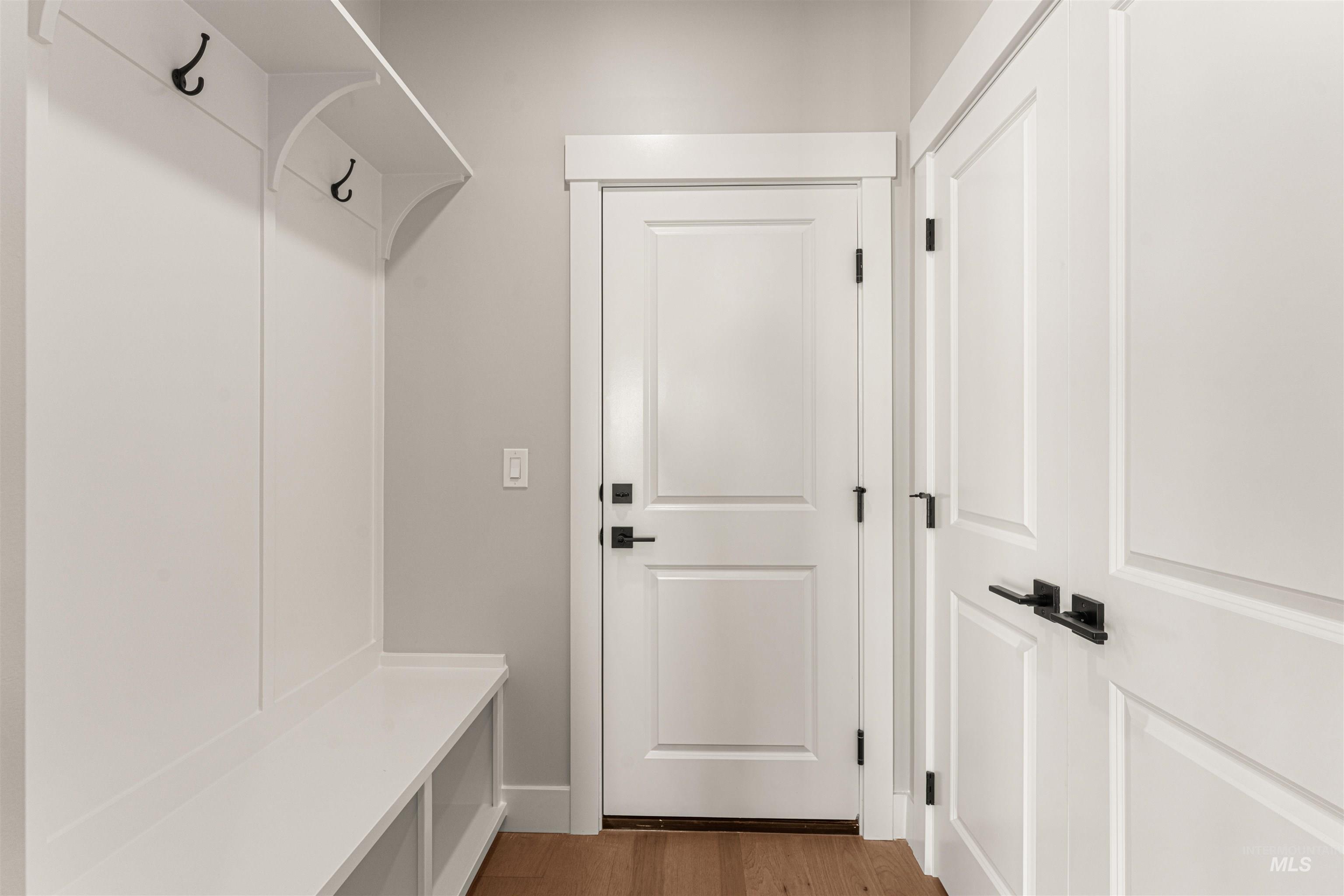 Mudroom with light wood-style floors