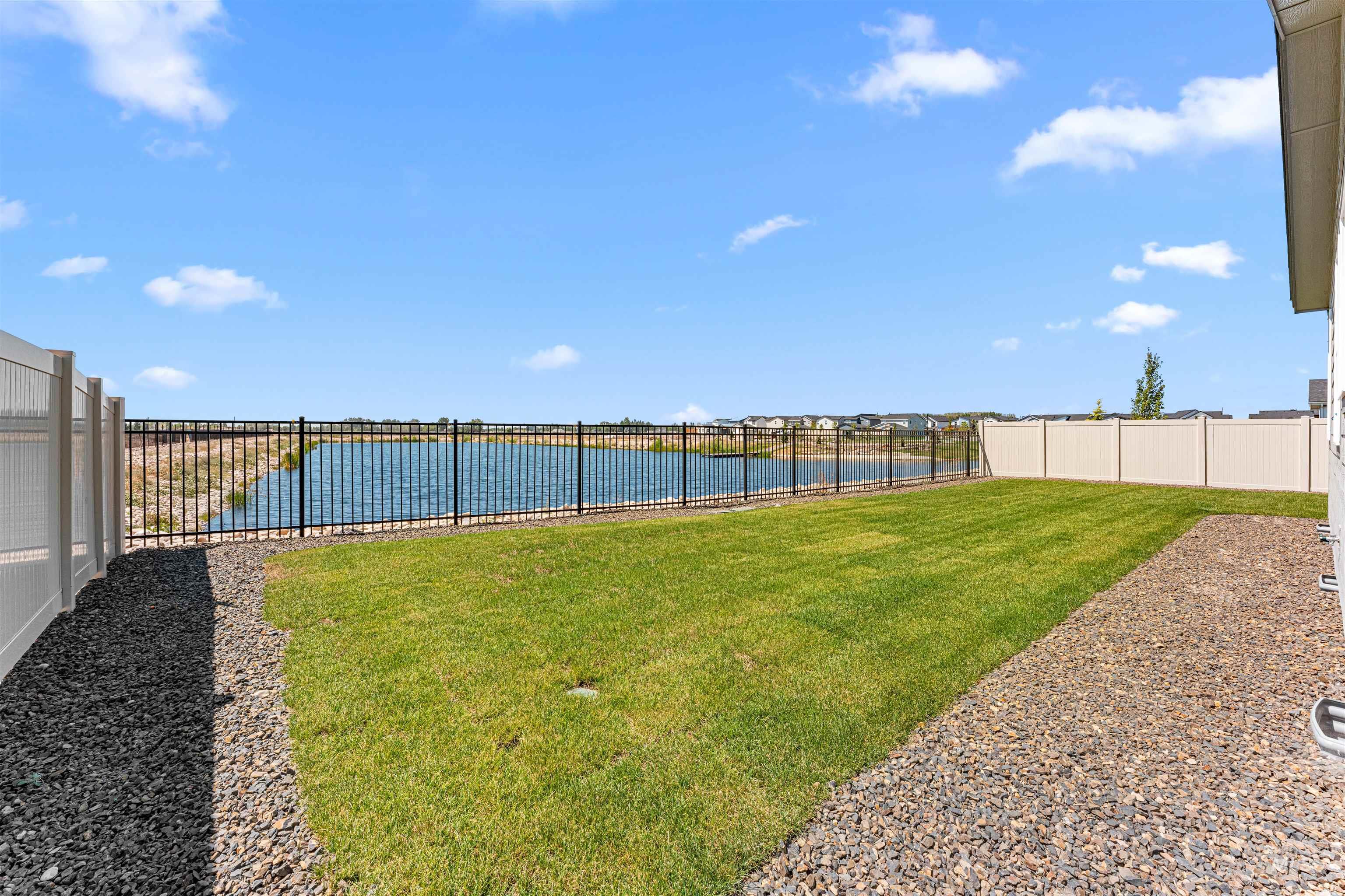 View of yard with a water view