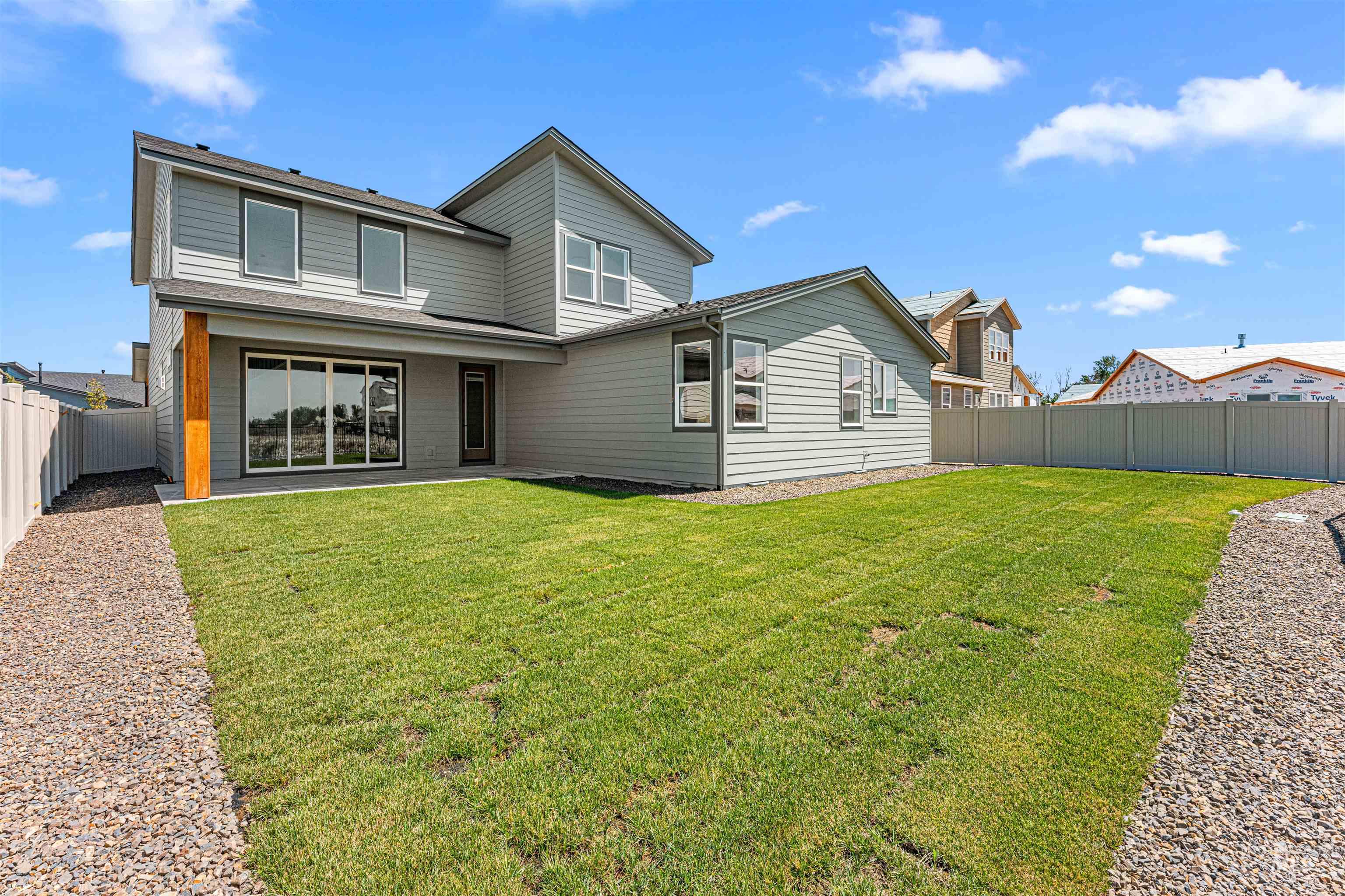 Back of property featuring a fenced backyard
