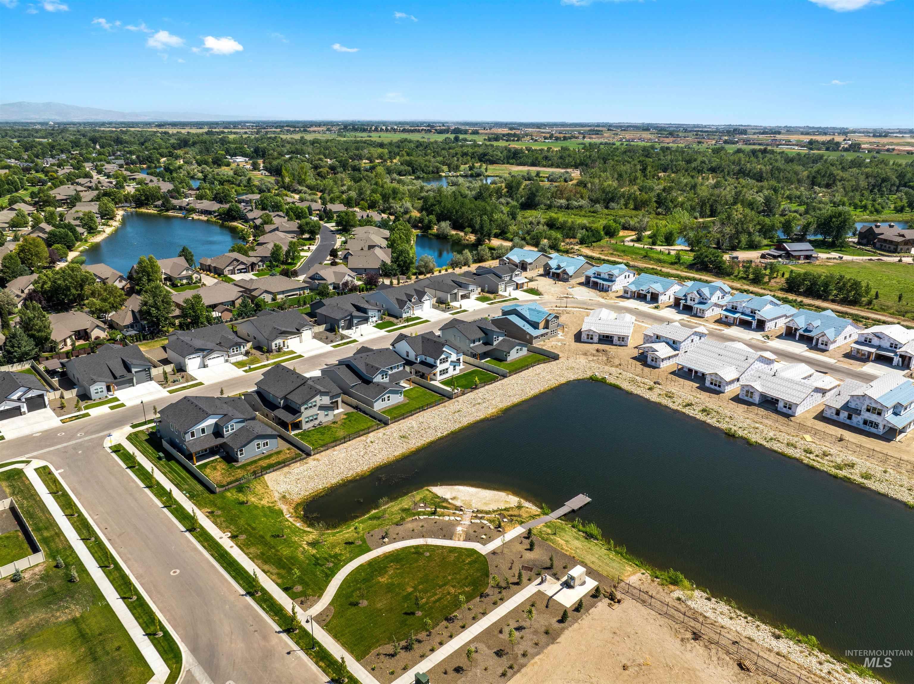 Aerial view of residential area with a nearby body of water