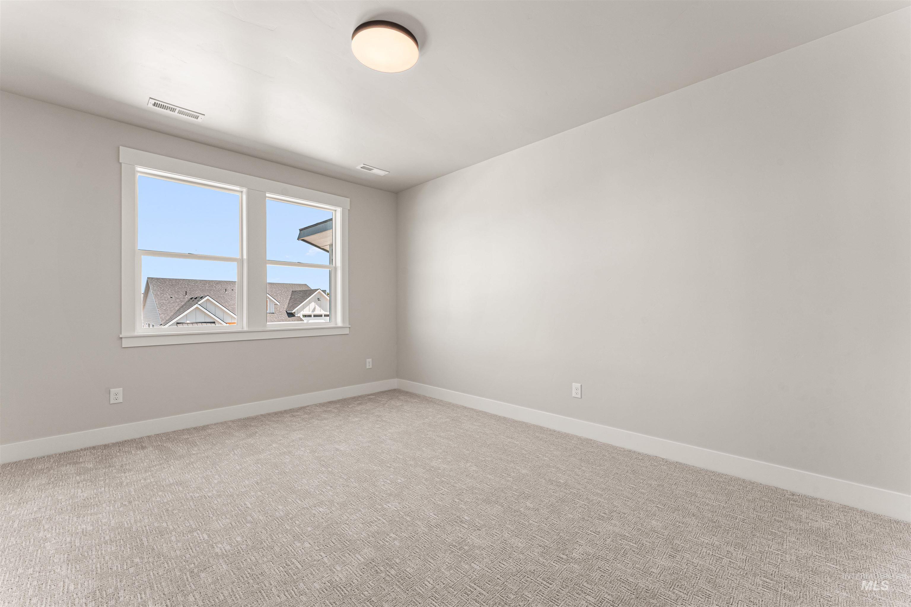 Unfurnished room with carpet