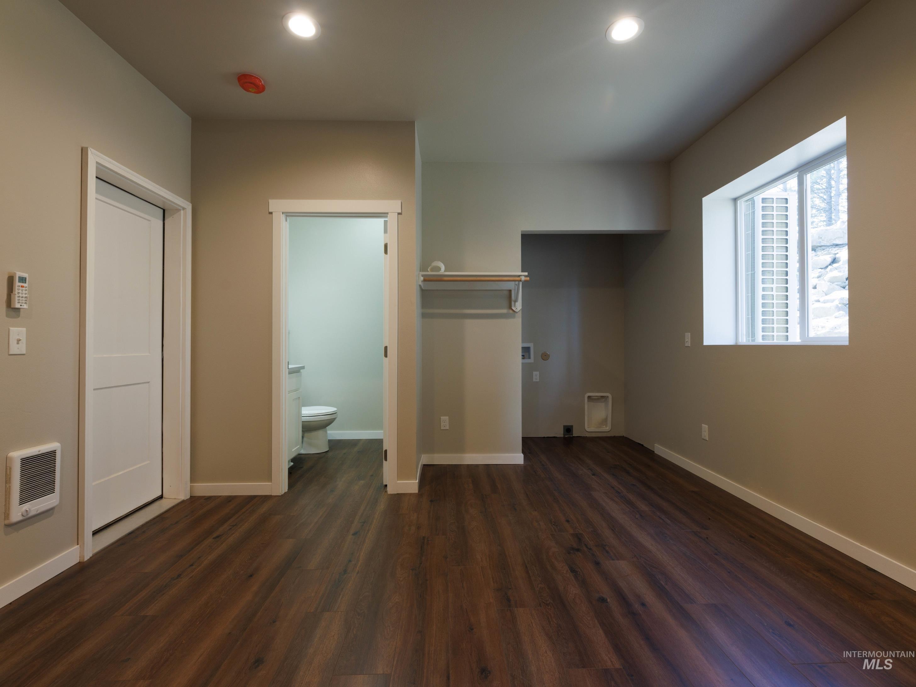 4th Bedroom - back of the garage with a 3/4 bath and laundry hook-ups