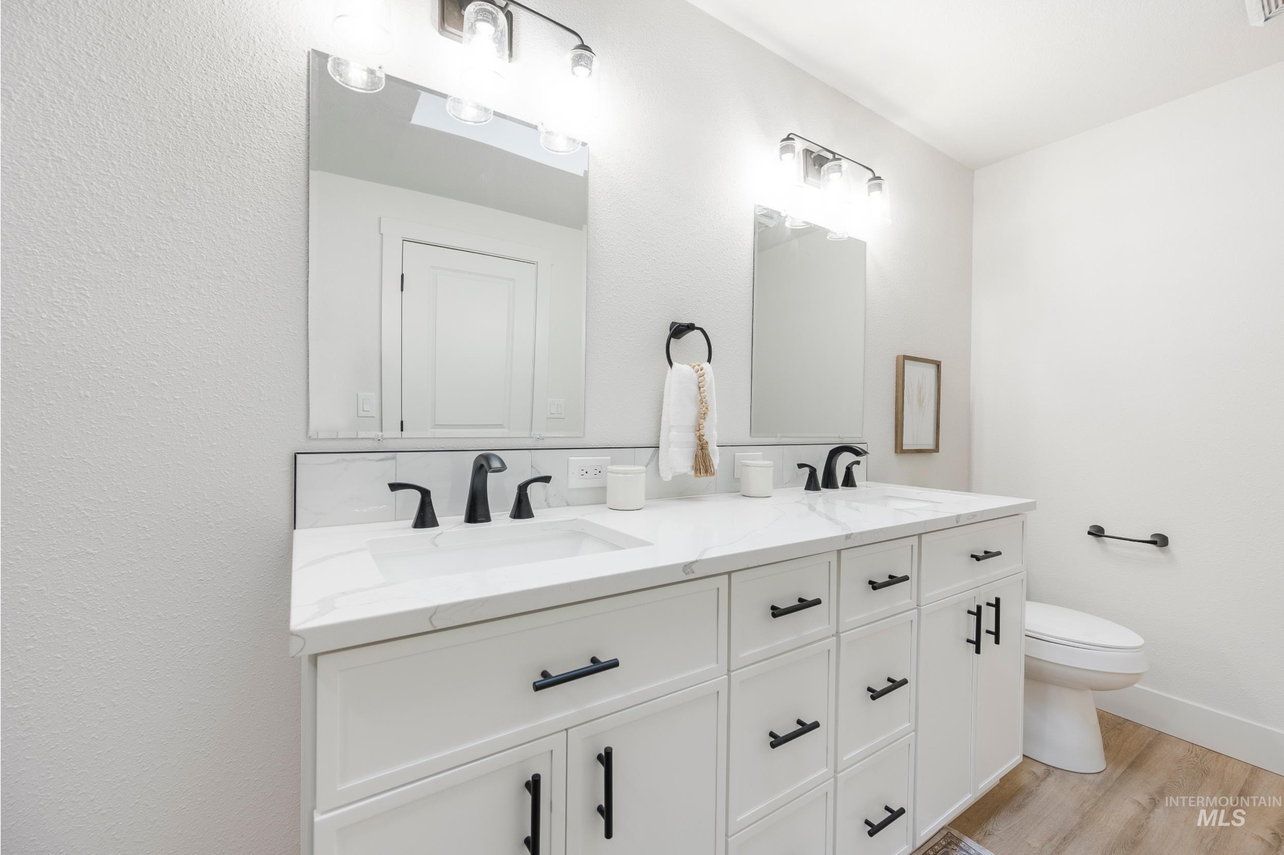 Bathroom with a sink and light wood-style flooring