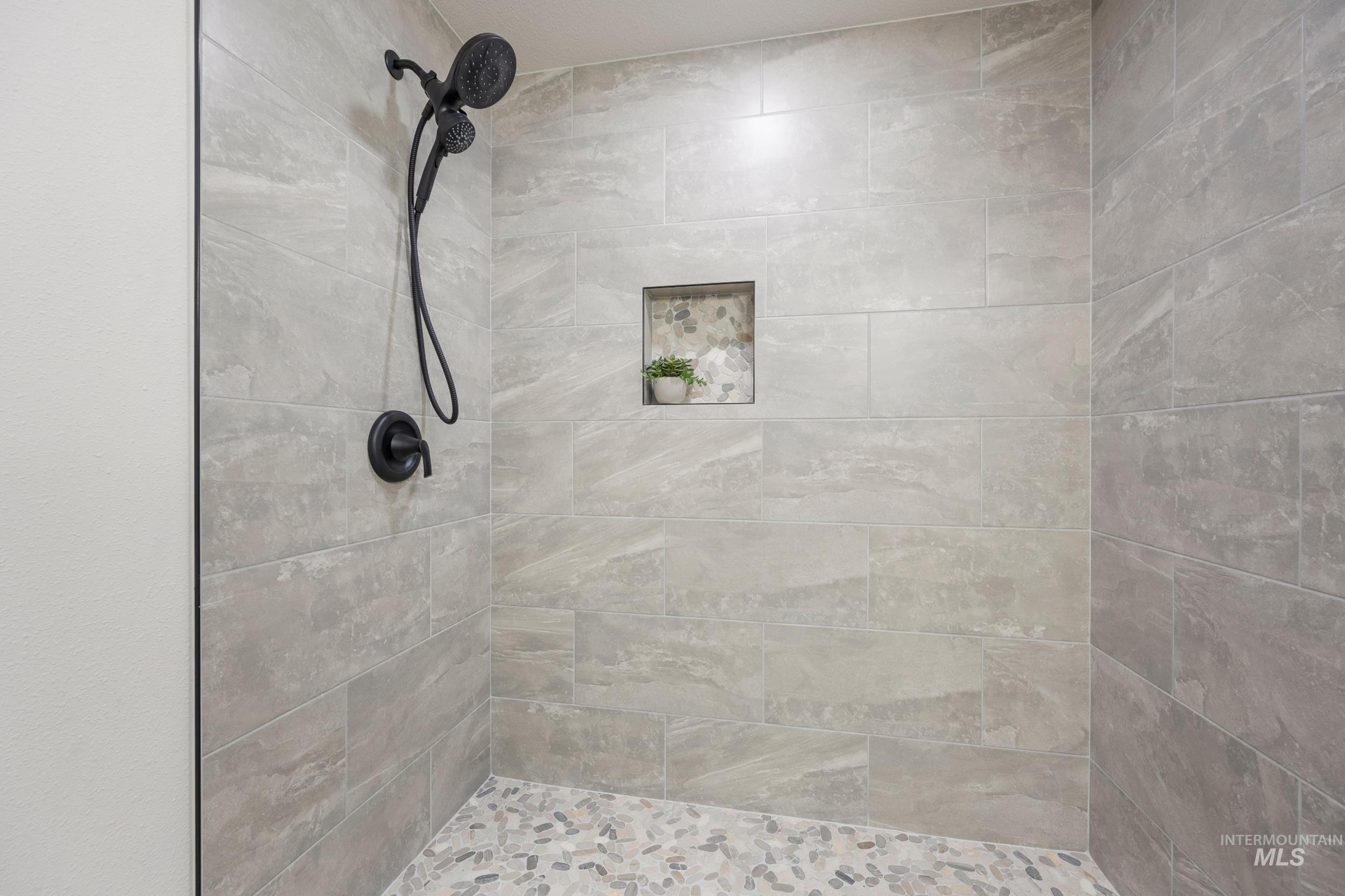 Bathroom featuring a shower stall