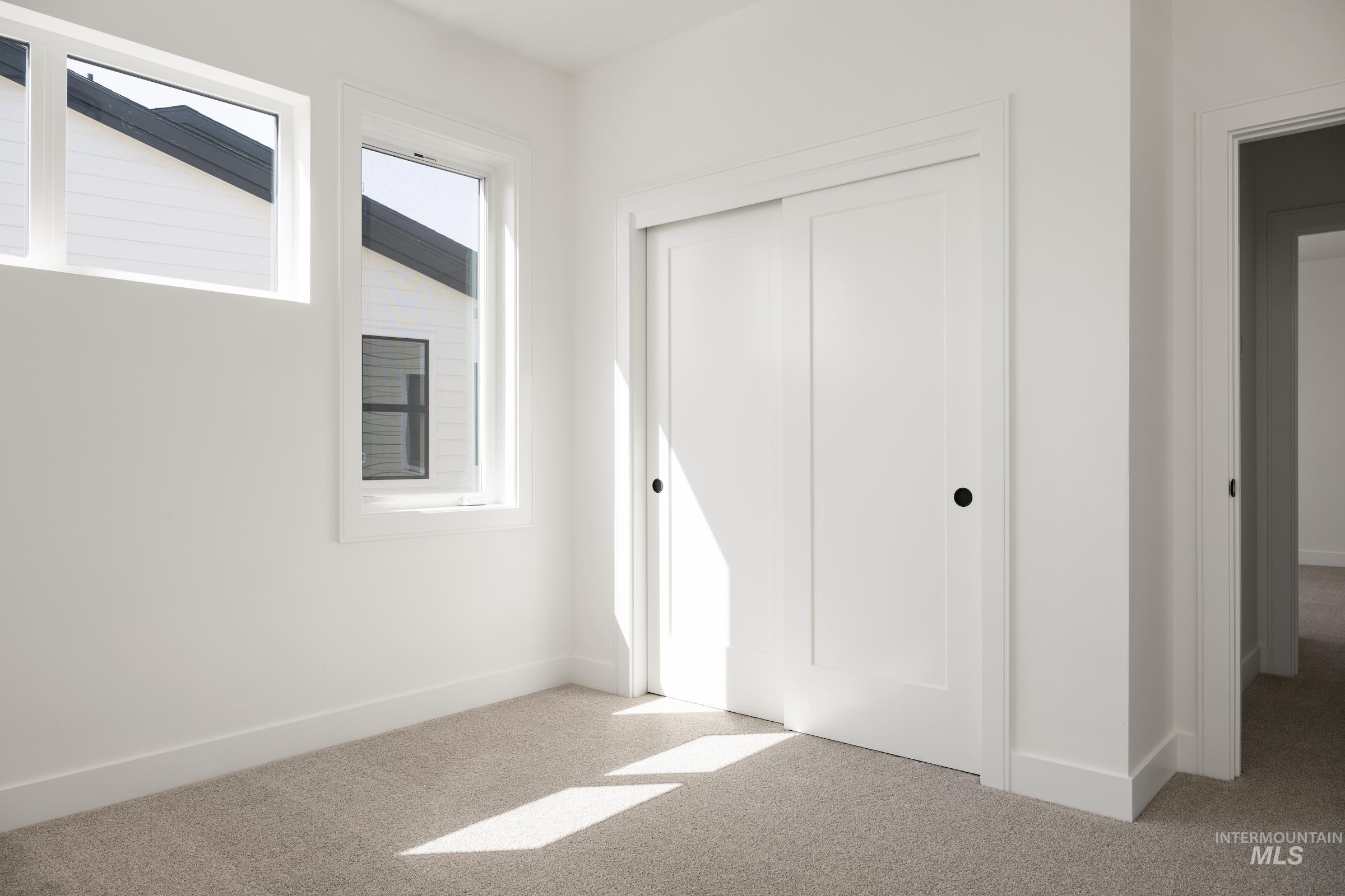 Unfurnished bedroom with carpet floors and a closet