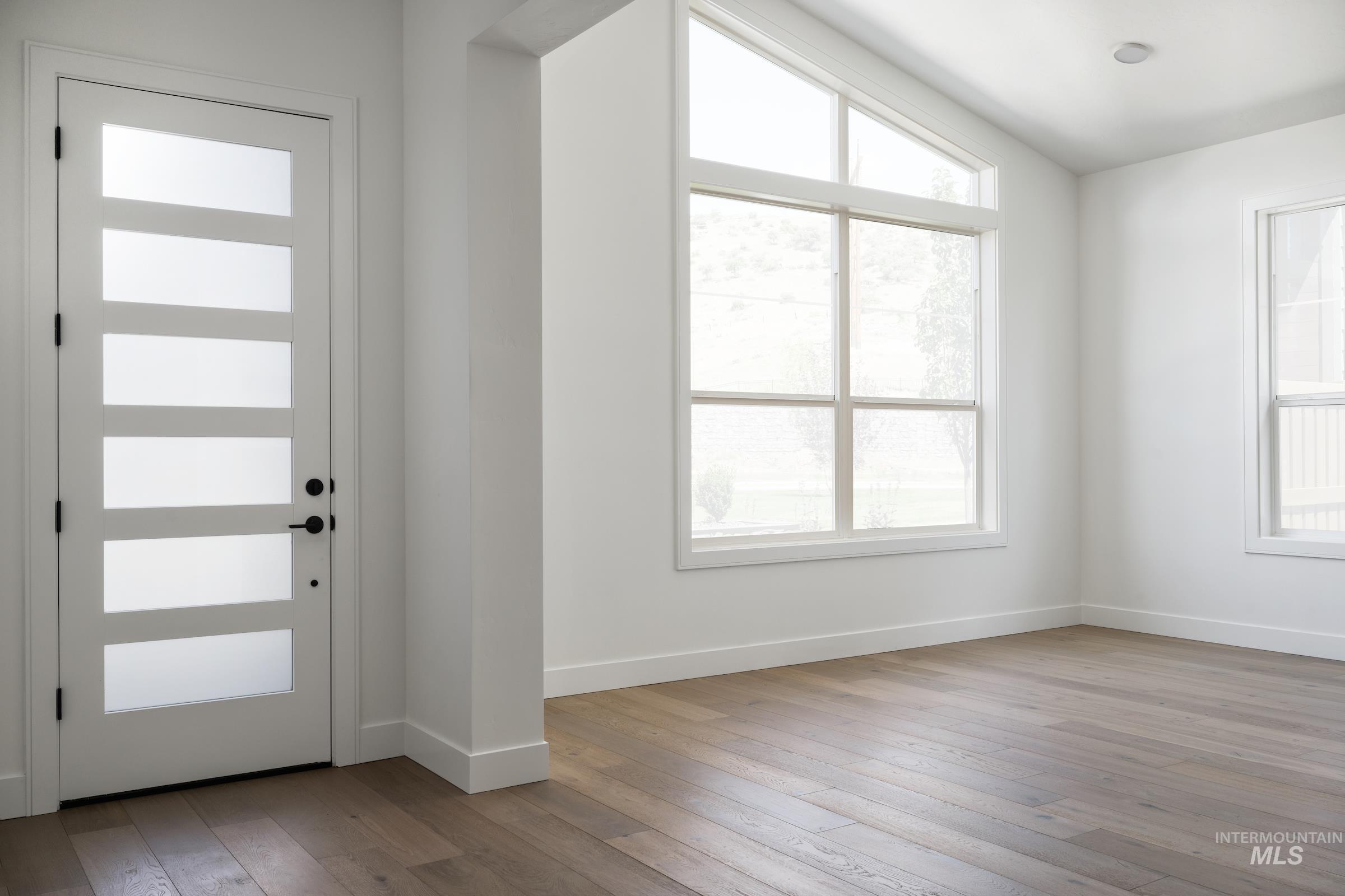 Entrance foyer with light wood finished floors