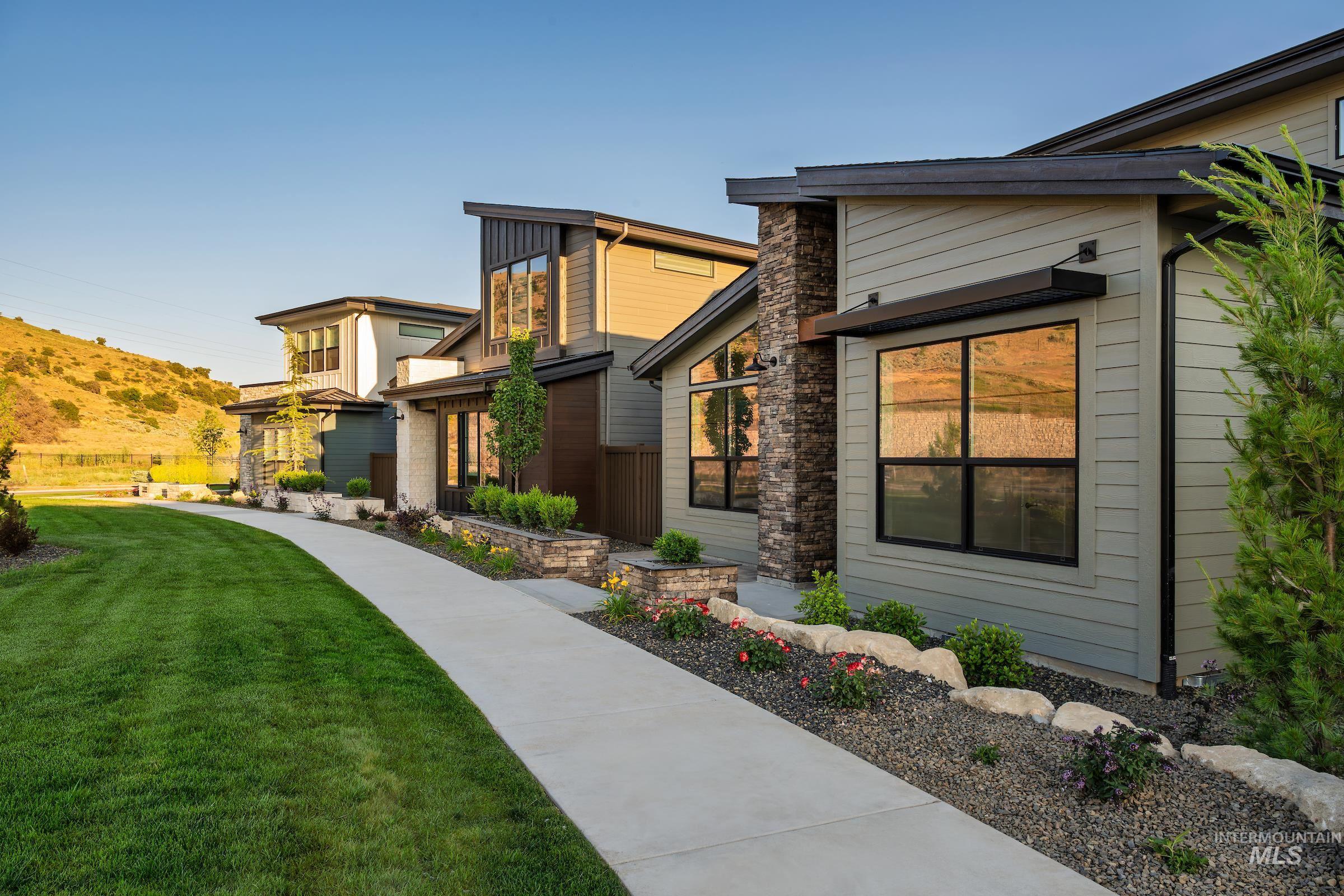 View of property exterior featuring a lawn