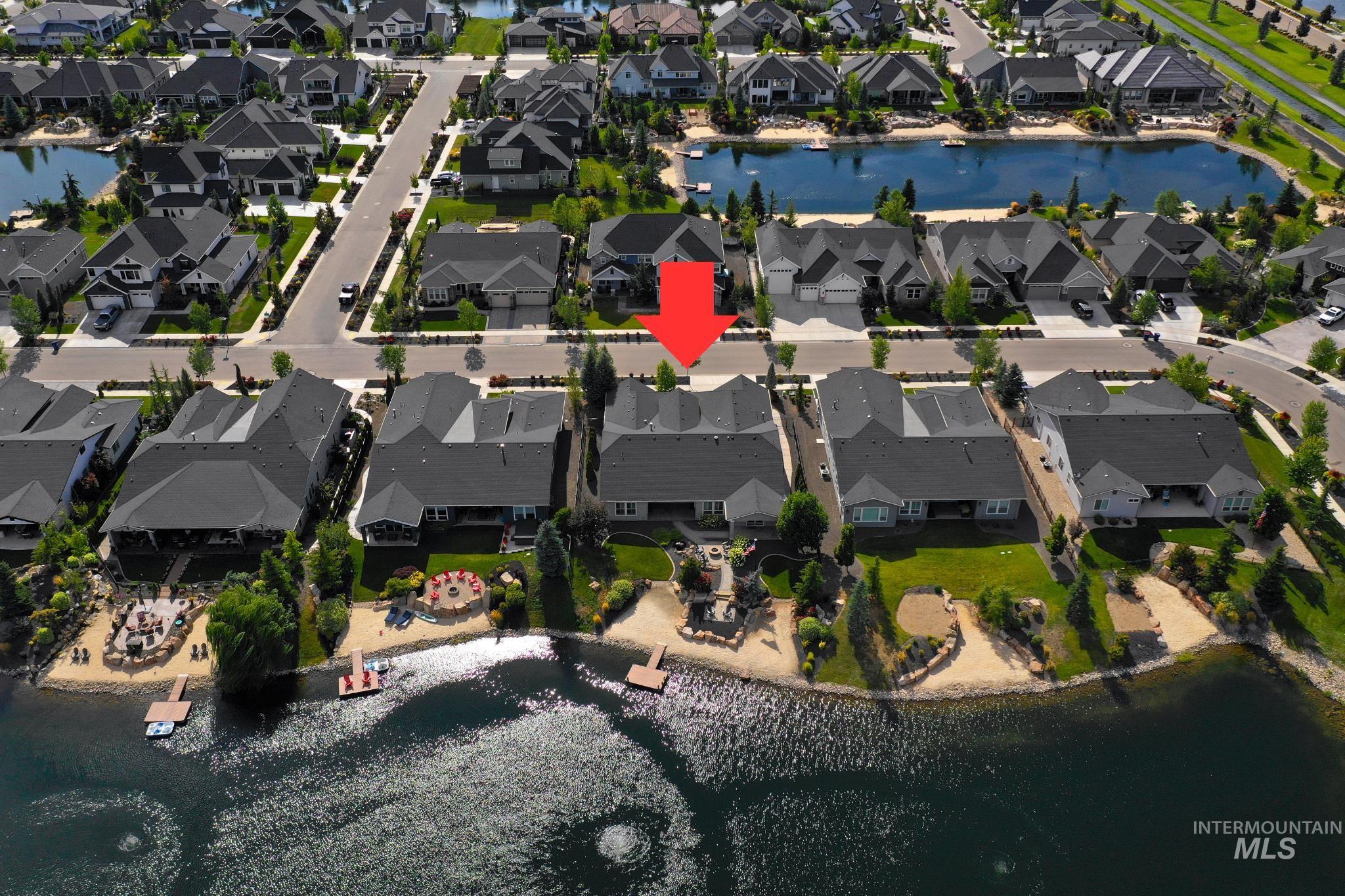 Aerial view of property and surrounding area featuring a large body of water